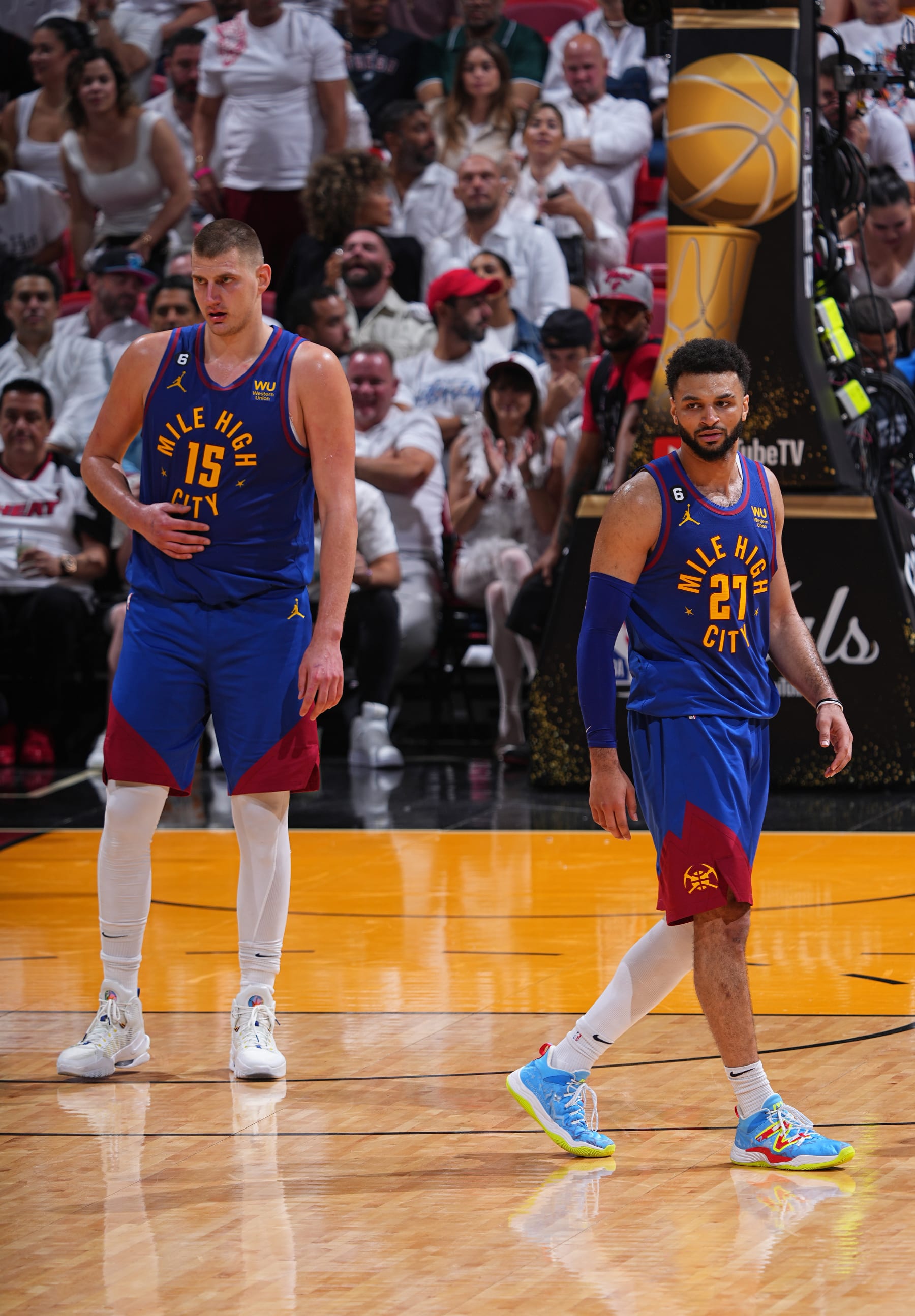 MIAMI, FL - JUNE 7: Nikola Jokic #15 and Jamal Murray #27 of the Denver Nuggets stand on the court during Game Three of the 2023 NBA Finals against the Miami Heat on June 7, 2023 at Kaseya Center in Miami, Florida. NOTE TO USER: User expressly acknowledges and agrees that, by downloading and or using this Photograph, user is consenting to the terms and conditions of the Getty Images License Agreement. Mandatory Copyright Notice: Copyright 2023 NBAE (Photo by Garrett Ellwood/NBAE via Getty Images)