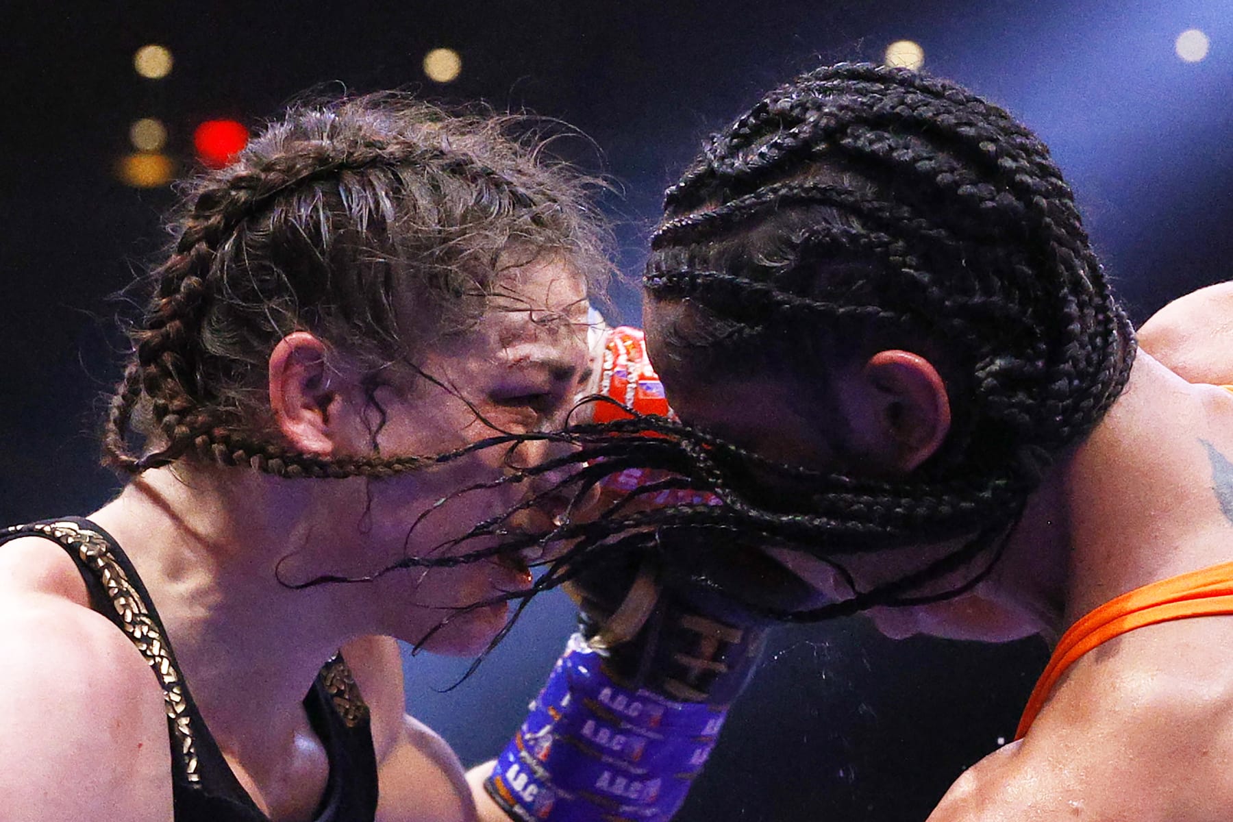 NEW YORK, NEW YORK - APRIL 30: Katie Taylor of Ireland (L) trades punches with Amanda Serrano of Puerto Rico (R) for the World Lightweight Title fight at Madison Square Garden on April 30, 2022 in New York, New York. This bout marks the first women’s boxing fight to headline Madison Square Garden in the venue’s history. Taylor defeated Serrano on a judges decision. (Photo by Sarah Stier/Getty Images)