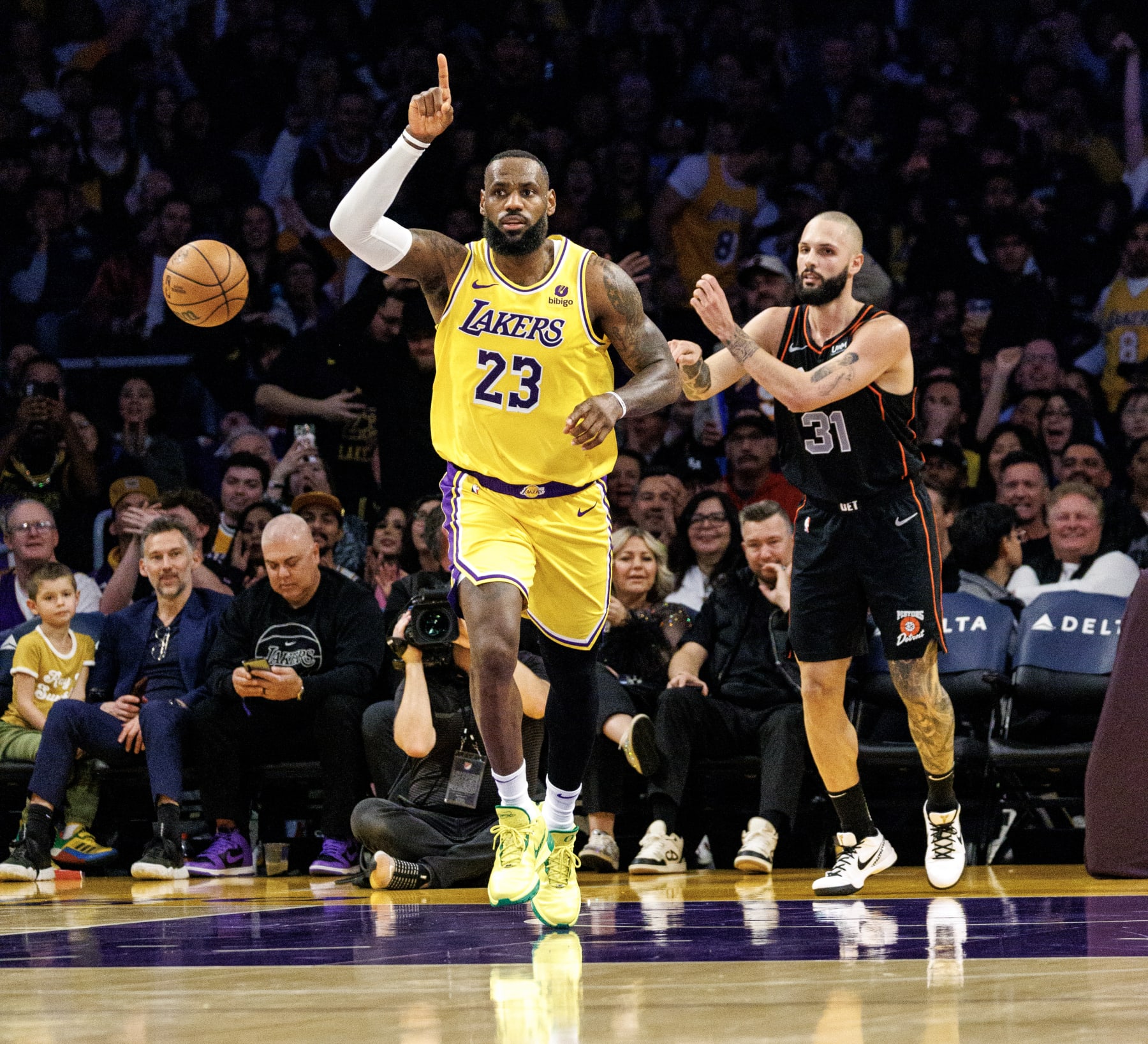 LOS ANGELES, CA - FEBRUARY 13, 2024:  Los Angeles Lakers forward LeBron James (23) reacts after scoring on a break away lay up against  Detroit Pistons forward Evan Fournier in the fist half   at Crypto.com Arena on February 13, 2024 in Los Angeles, California.(Gina Ferazzi / Los Angeles Times via Getty Images)