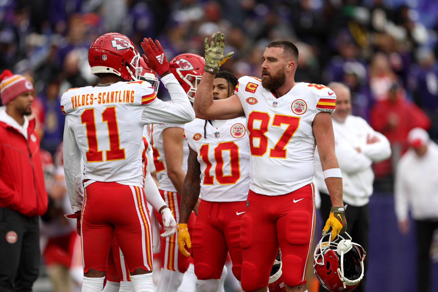 BALTIMORE, MARYLAND - JANUARY 28: Tight end Travis Kelce #87 of the Kansas City Chiefs talks with wide receiver Marquez Valdes-Scantling #11 during warmups before playing the Baltimore Ravens in the AFC Championship Game  at M&T Bank Stadium on January 28, 2024 in Baltimore, Maryland. (Photo by Rob Carr/Getty Images)