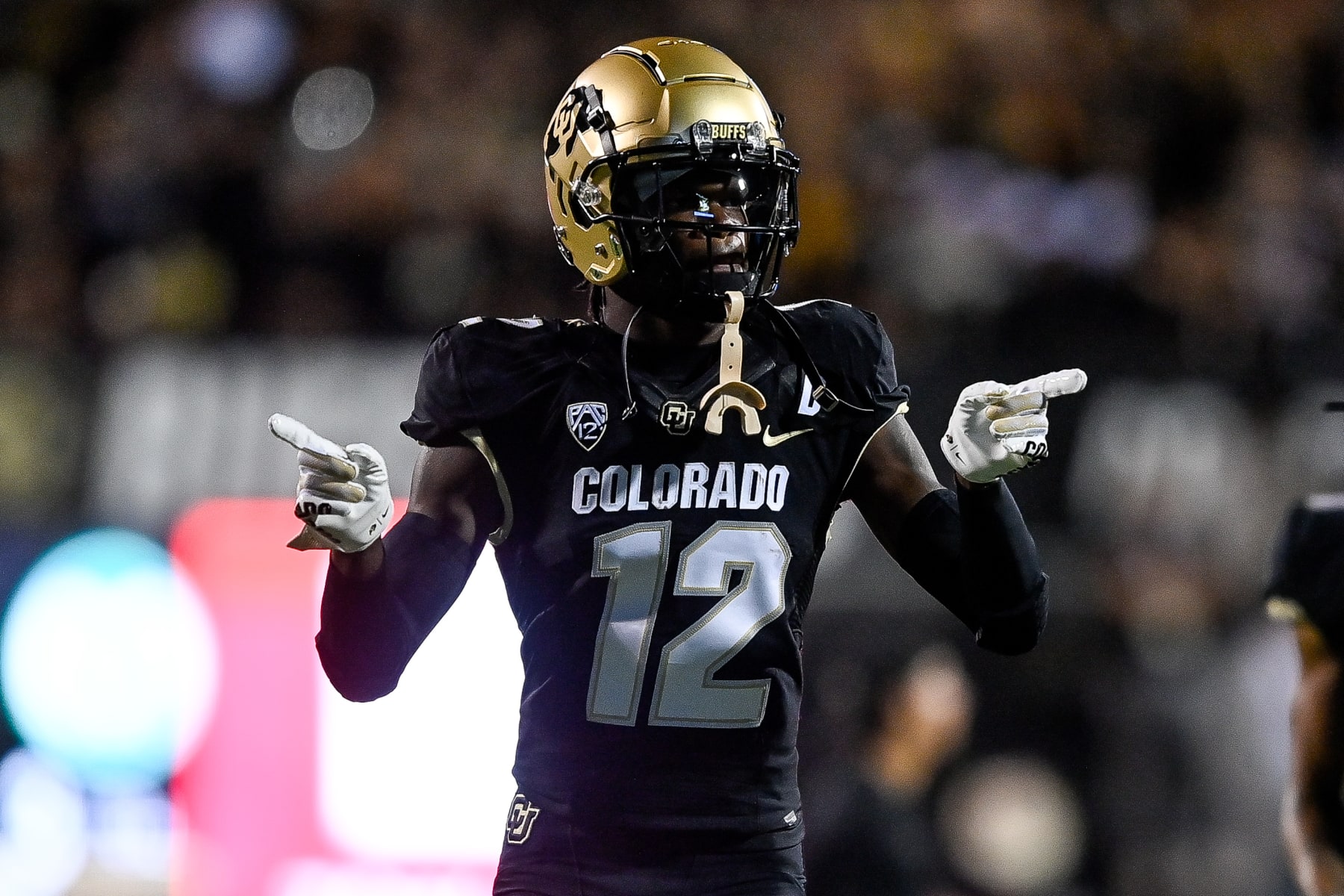 BOULDER, CO - SEPTEMBER 16:  Cornerback Travis Hunter #12 of the Colorado Buffaloes stands on the field before the start of a game against the Colorado State Rams at Folsom Field on September 16, 2023 in Boulder, Colorado. (Photo by Dustin Bradford/Getty Images)