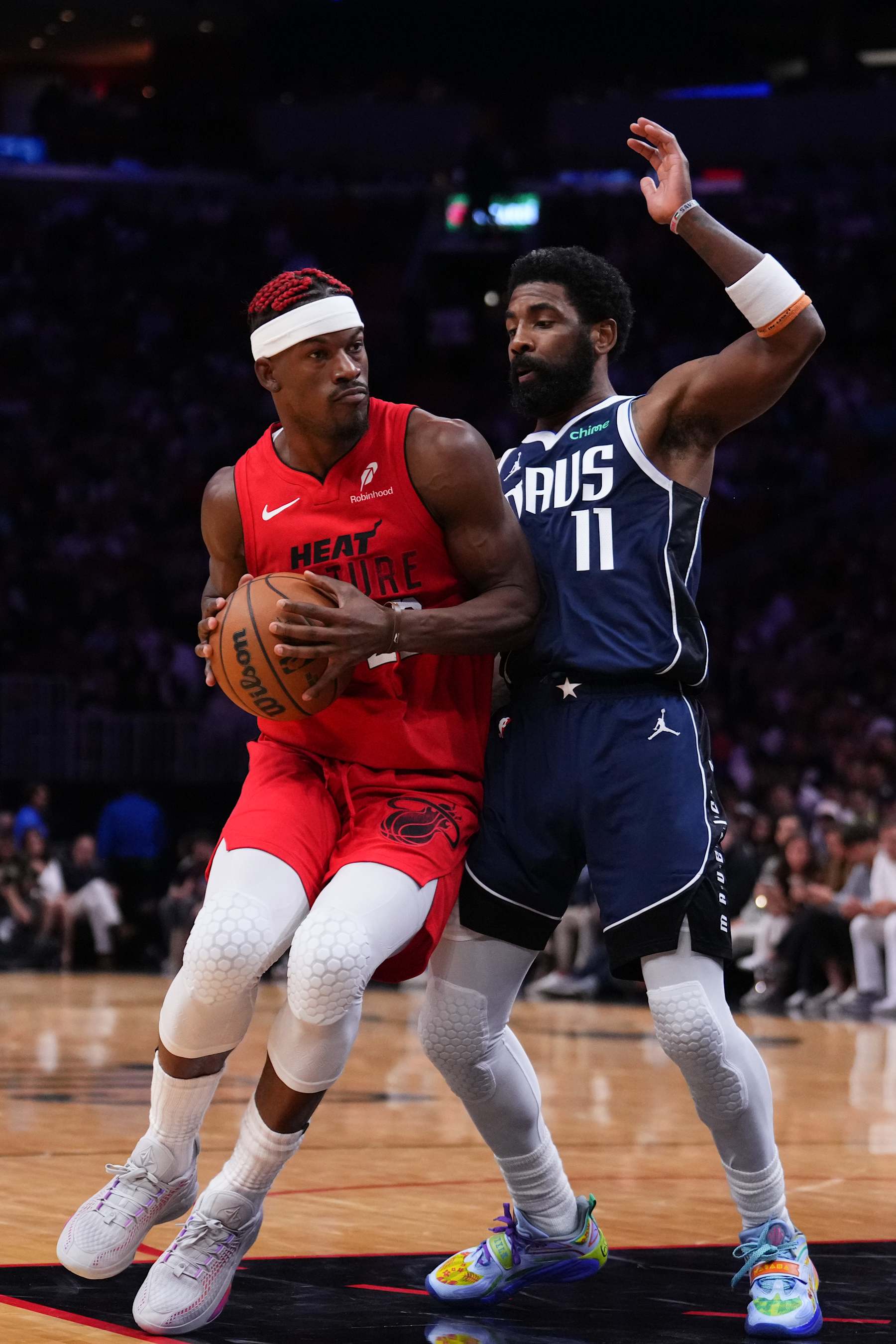 MIAMI, FLORIDA - NOVEMBER 24: Jimmy Butler #22 of the Miami Heat dribbles the ball against Kyrie Irving #11 of the Dallas Mavericks during the fourth quarter at Kaseya Center on November 24, 2024 in Miami, Florida. NOTE TO USER: User expressly acknowledges and agrees that, by downloading and or using this photograph, User is consenting to the terms and conditions of the Getty Images License Agreement. (Photo by Rich Storry/Getty Images)
