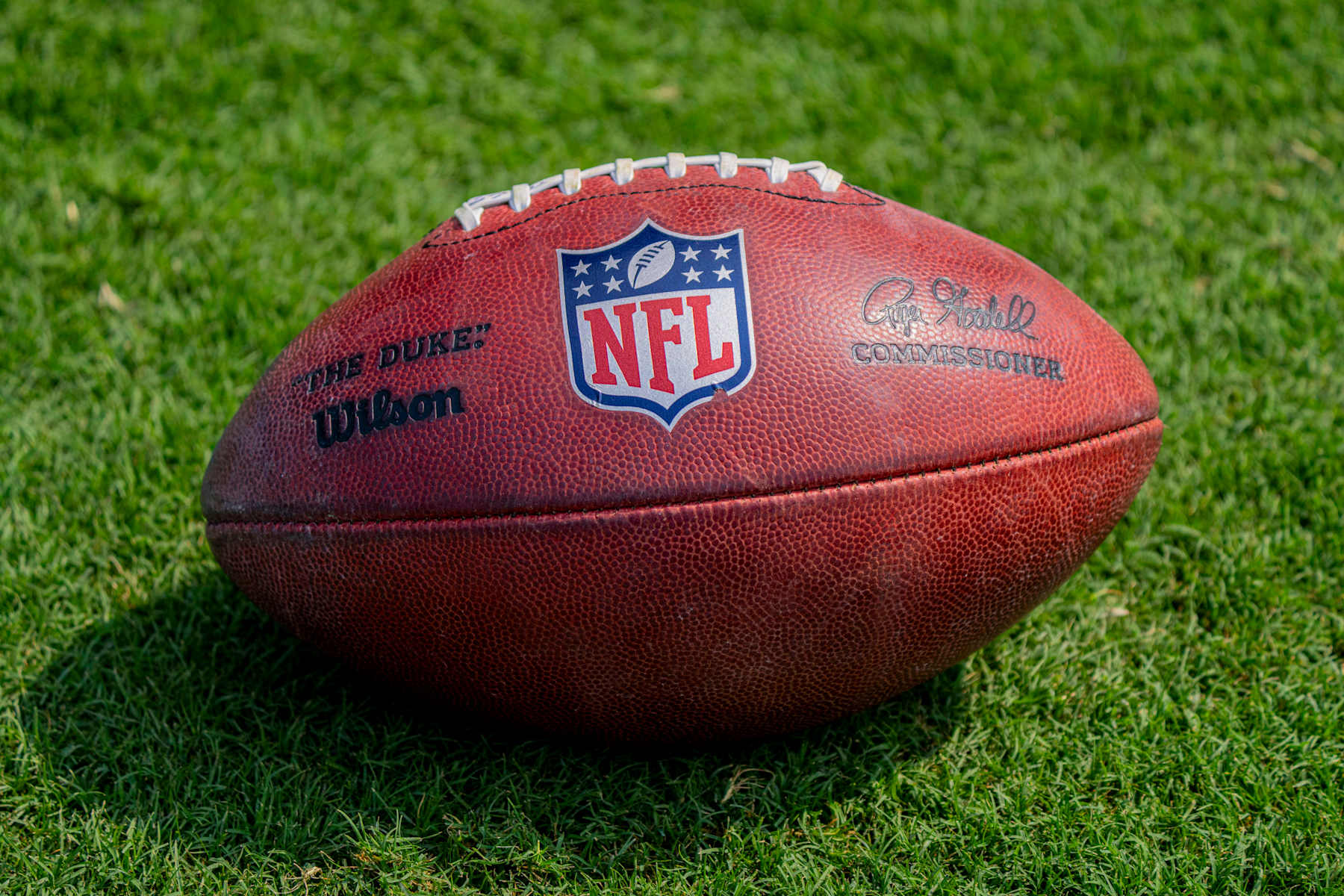 CHICAGO, IL - SEPTEMBER 08: A football bearing the NFL logo and the signature of NFL Commissioner Roger Goodell rests on the sideline during the game between the Tennessee Titans and the Chicago Bears at Soldier Field on September 8, 2024 in Chicago, Illinois. (Photo by Ben Hsu/Icon Sportswire via Getty Images)