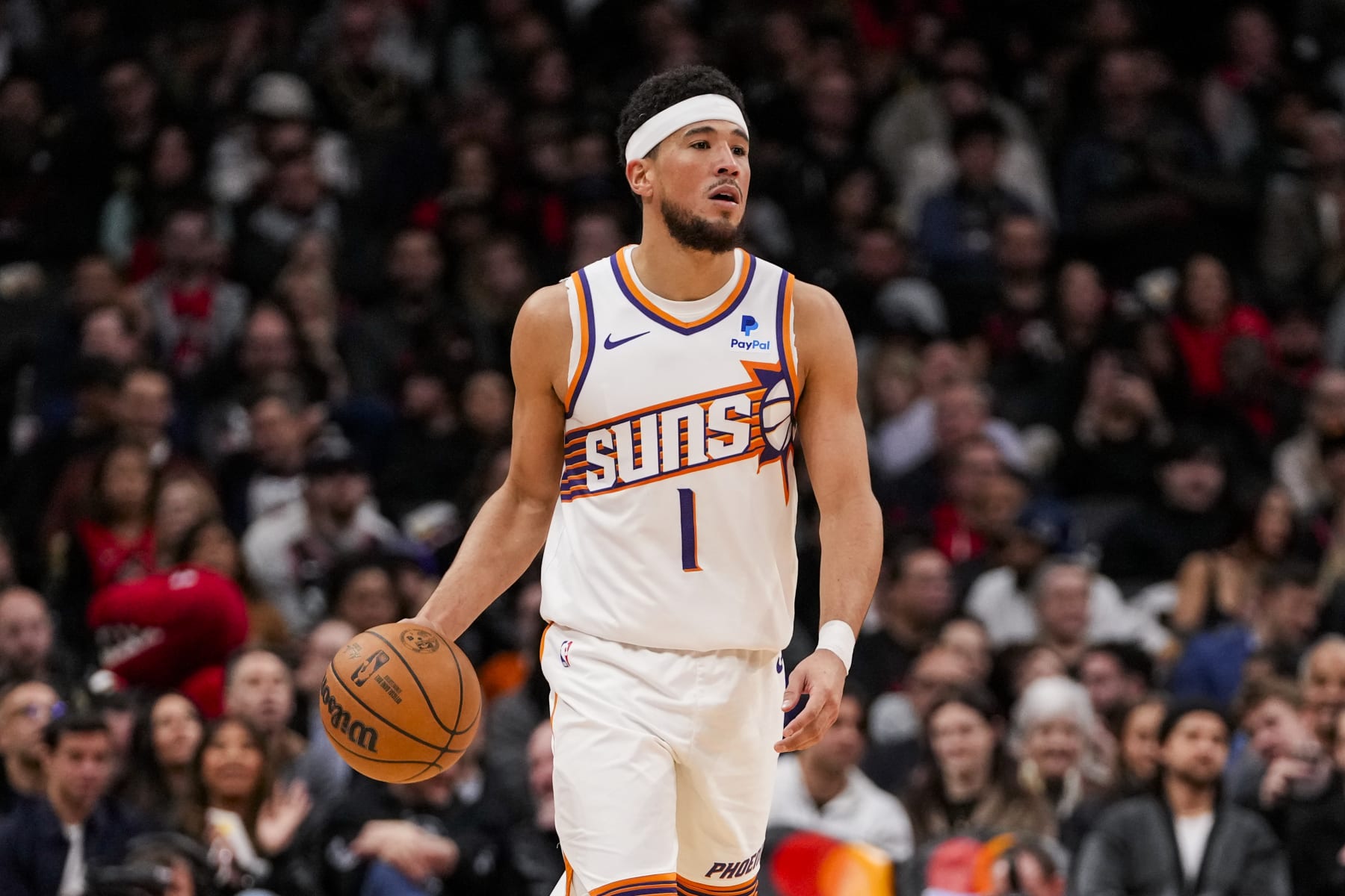 TORONTO, ON - NOVEMBER 29: Devin Booker #1 of the Phoenix Suns dribbles the ball against the Toronto Raptors during NBA action at the Scotiabank Arena on November 29, 2023 in Toronto, Ontario, Canada. NOTE TO USER: User expressly acknowledges and agrees that, by downloading and/or using this Photograph, user is consenting to the terms and conditions of the Getty Images License Agreement. (Photo by Andrew Lahodynskyj/Getty Images)