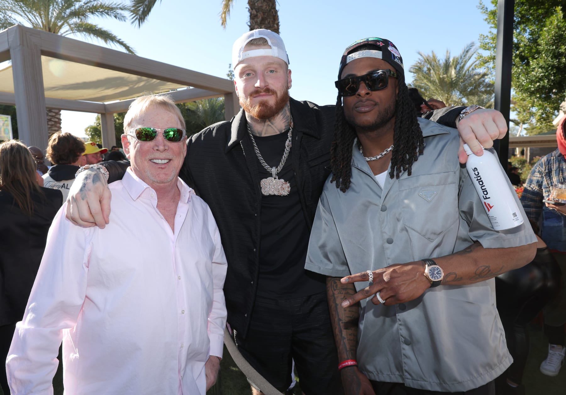 PHOENIX, ARIZONA - FEBRUARY 11: (L-R) Mark Davis, Maxx Crosby, and Davante Adams attend Michael Rubin's 2023 Fanatics Super Bowl Party at the Arizona Biltmore on February 11, 2023 in Phoenix, Arizona. (Photo by Rich Polk/Getty Images for Fanatics)
