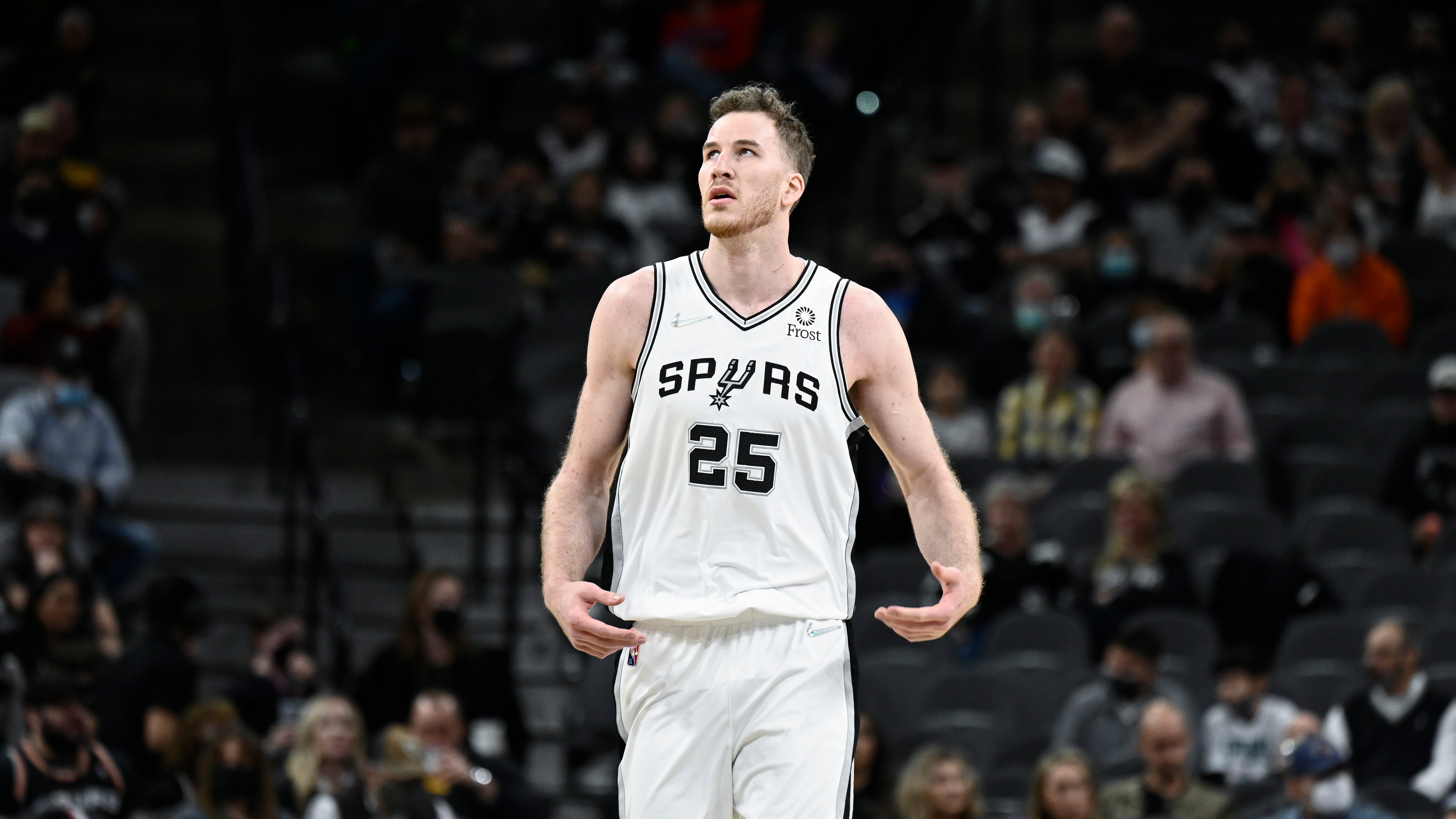 San Antonio Spurs' Jakob Poeltl walks up the court during the first half of an NBA basketball game against the Philadelphia 76ers, Sunday, Jan. 23, 2022, in San Antonio. (AP Photo/Darren Abate)