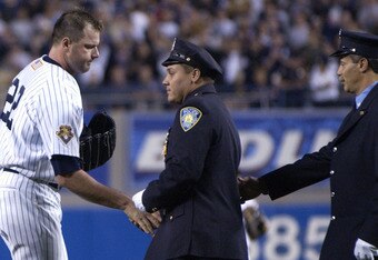 25 Sep 2001 : Roger Clemens of the New York Yankees greets members of the NY police dept. during pre-game ceremonies of the game against the Tampa Bay Devil Rays at Yankee Stadium in the Bronx, New York. The Devil Rays won 4-0. DIGITAL IMAGE. Mandatory Cr