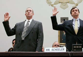 WASHINGTON - FEBRUARY 13:  Major League Baseball pitcher Roger Clemens (R), Charlie Scheeler, investigator on former Sen. George Mitchell's staff (C) and and former Major League Baseball strength and conditioning coach Brian McNamee (L) raise their right