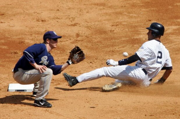 NEW YORK - JUNE 19:  Derek Jeter #2 of the New York Yankees steals second base in the sixth inning ahead of the throw to Khalil Greene #3 of the San Diego Padres on June 19, 2008 at Yankee Stadium in the Bronx borough of New York City.  (Photo by Jim McIs