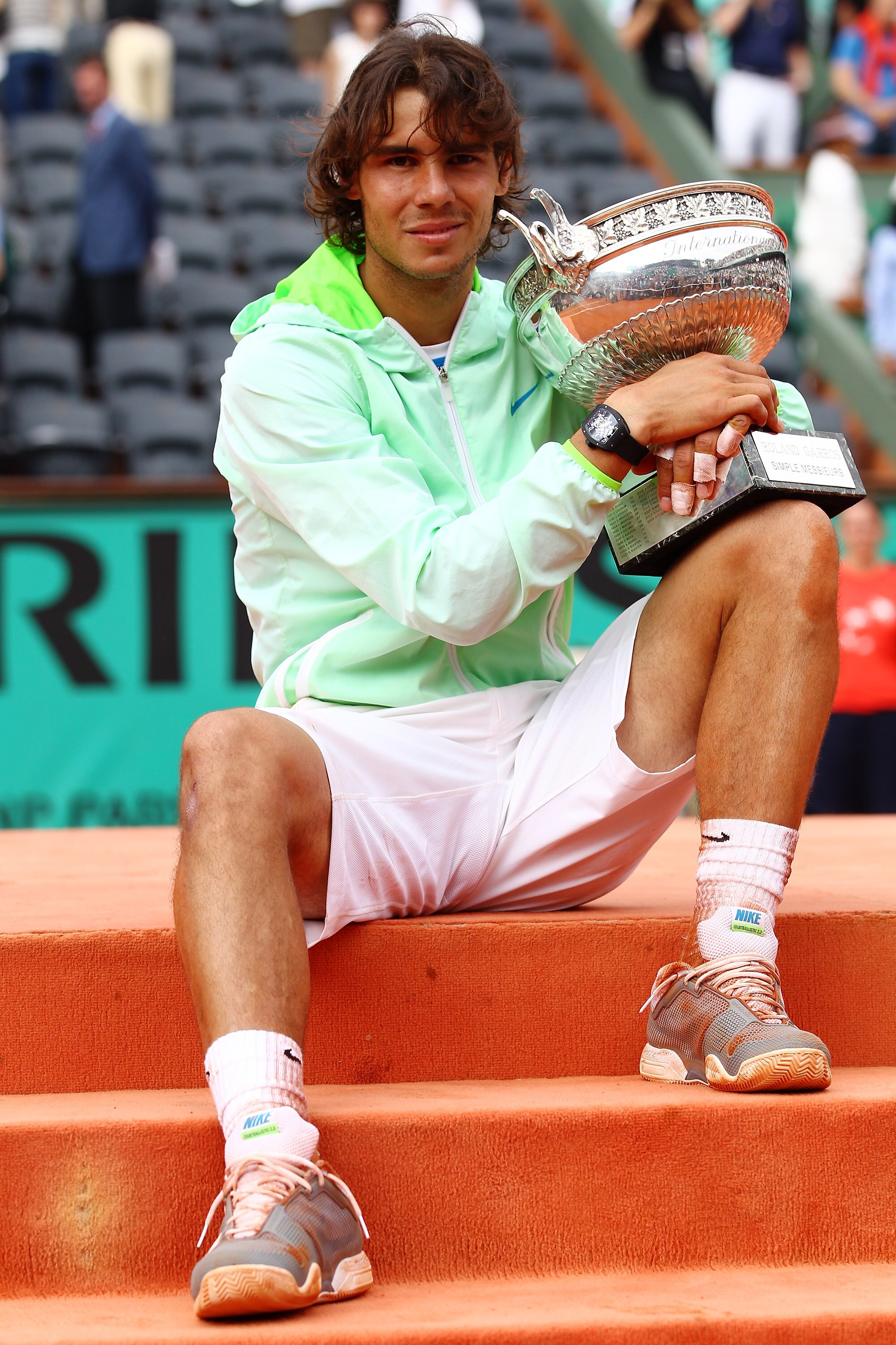 PARIS - JUNE 06:  Rafael Nadal of Spain celebrates with the trophy after winning the men's singles final match between Rafael Nadal of Spain and Robin Soderling of Sweden on day fifteen of the French Open at Roland Garros on June 6, 2010 in Paris, France.