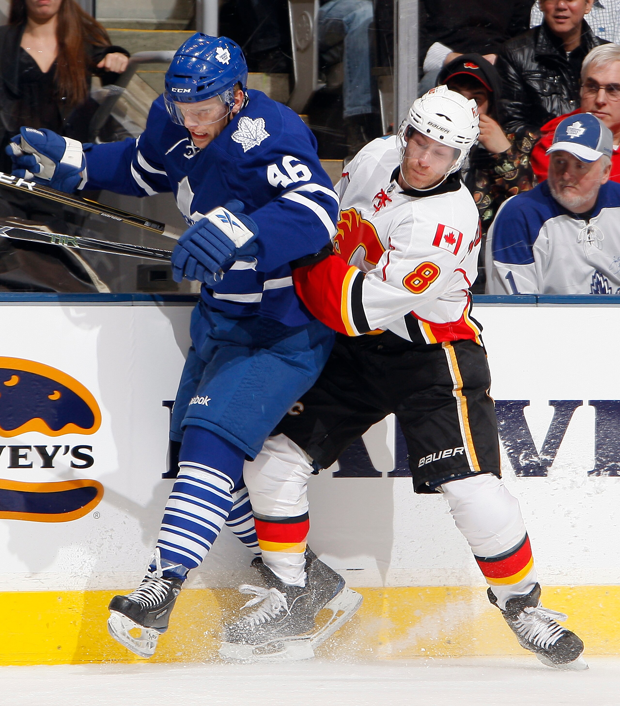 TORONTO, CANADA - JANUARY 15: Joey Crabb #46 of the Toronto Maple Leafs runs into Brendan Morrison #8 of the Calgary Flames during game action at the Air Canada Centre January 15, 2011 in Toronto, Ontario, Canada. (Photo by Abelimages/Getty Images) TORONTO, CANADA - JANUARY 15: Joey Crabb #46 of the Toronto Maple Leafs runs into Brendan Morrison #8 of the Calgary Flames during game action at the Air Canada Centre January 15, 2011 in Toronto, Ontario, Canada. (Photo by Abelimages/Getty Images)
