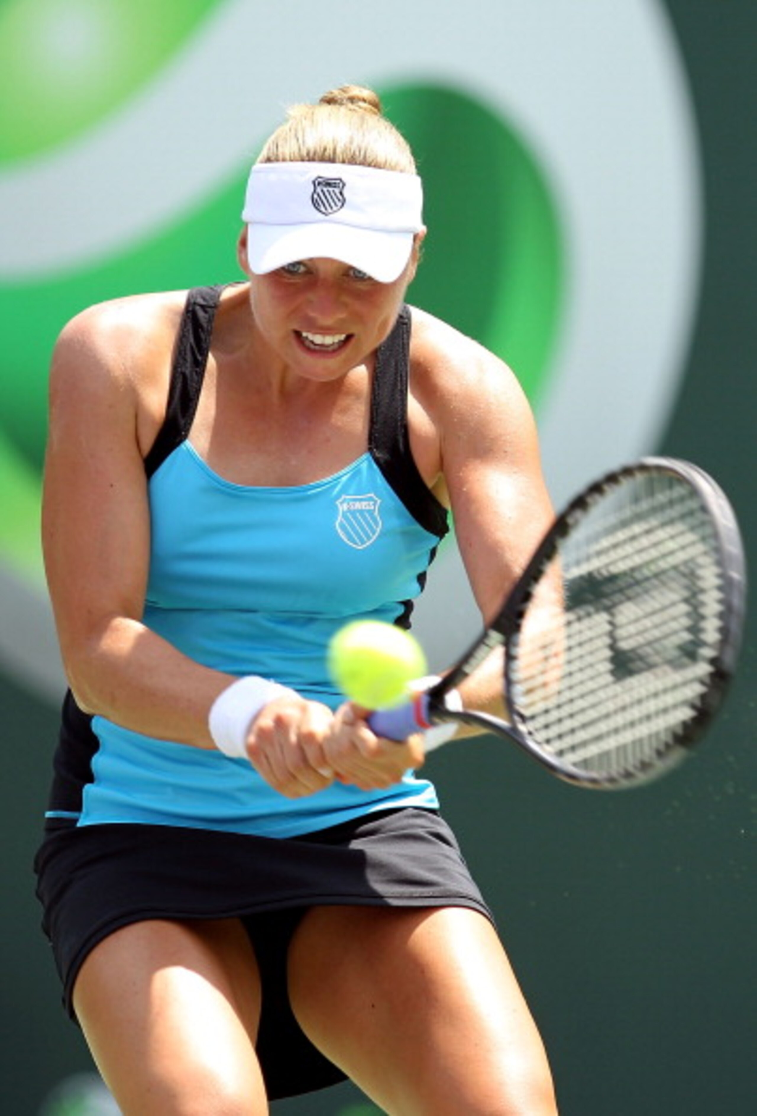 KEY BISCAYNE, FL - MARCH 30:  Vera Zvonareva of Russia hits a backhand return against Agnieszka Radwanska of Poland during the Sony Ericsson Open at Crandon Park Tennis Center on March 30, 2011 in Key Biscayne, Florida.  (Photo by Al Bello/Getty Images)