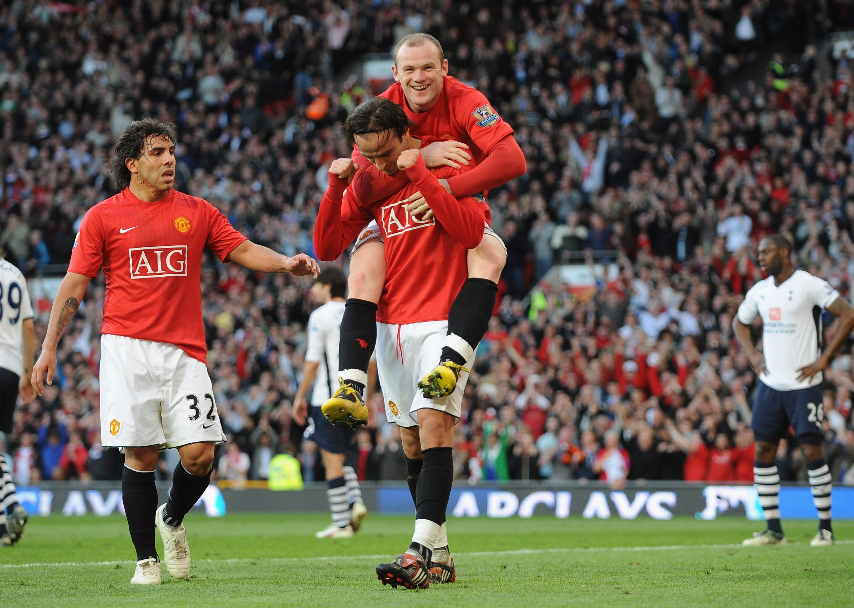 MANCHESTER, ENGLAND - APRIL 25:  Dimitar Berbatov of Manchester United is congratulated by team mate Wayne Rooney after scoring his team's fifth goal during the Barclays Premier League match between Manchester United and Tottenham Hotspur at Old Trafford
