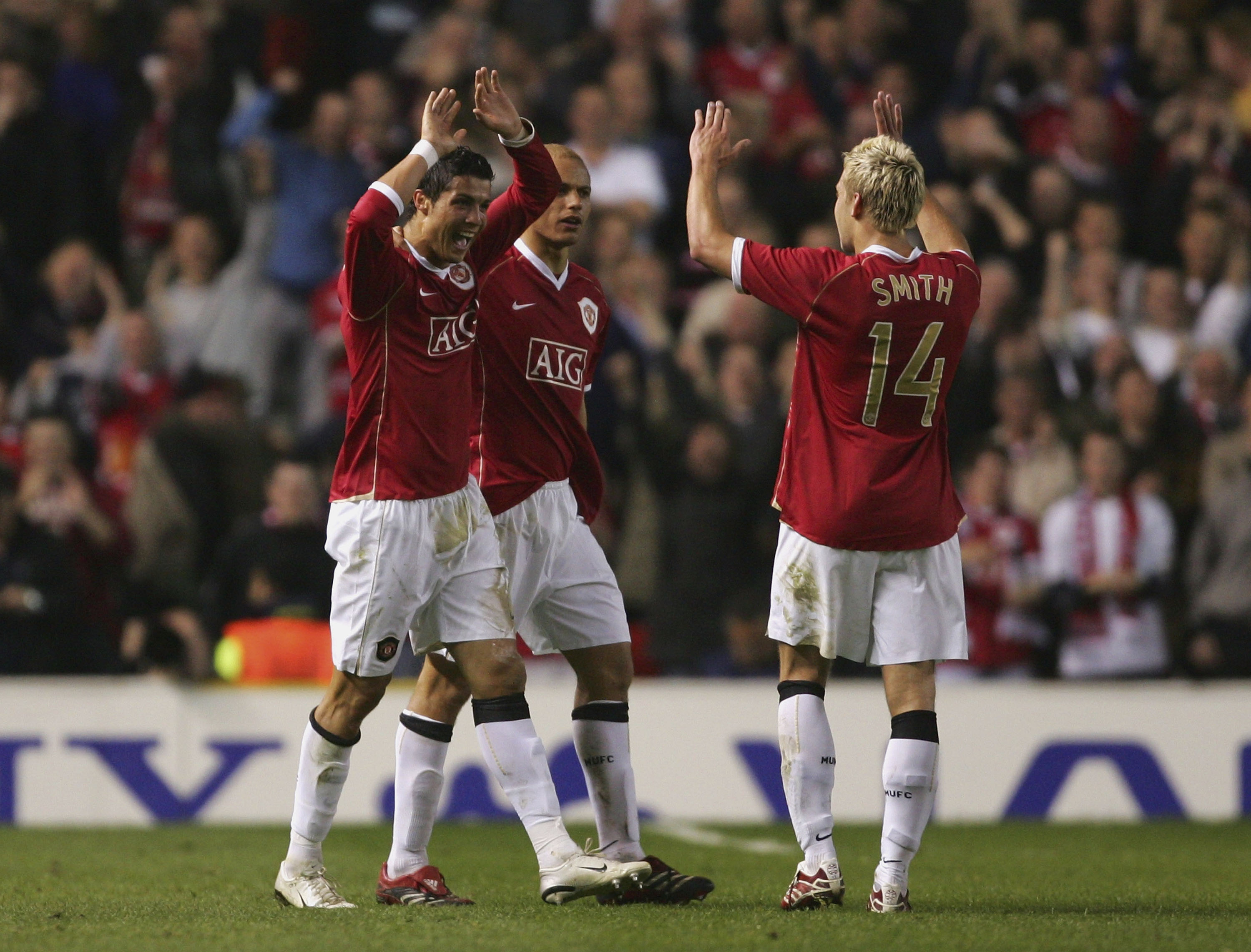 MANCHESTER, UNITED KINGDOM - APRIL 10:  Cristiano Ronaldo of Manchester United celebrates scoring his team's fourth goal with team mate Alan Smith during the UEFA Champions League Quarter Final, second leg match between Manchester United and AS Roma at Ol