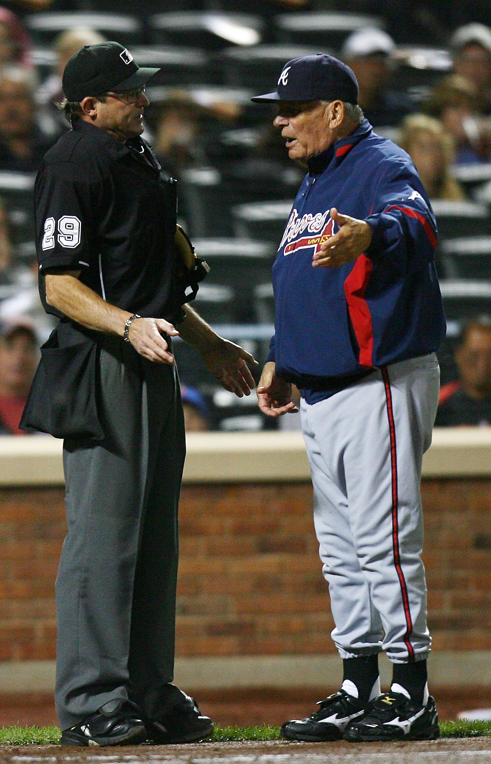NEW YORK - SEPTEMBER 17:  Home plate umpire Bill Hohn #29 argues with Bobby Cox of the Atlanta Braves during a game against the New York Mets on September 17, 2010 at Citi Field in the Flushing neighborhood of the Queens borough of New York City.  (Photo 