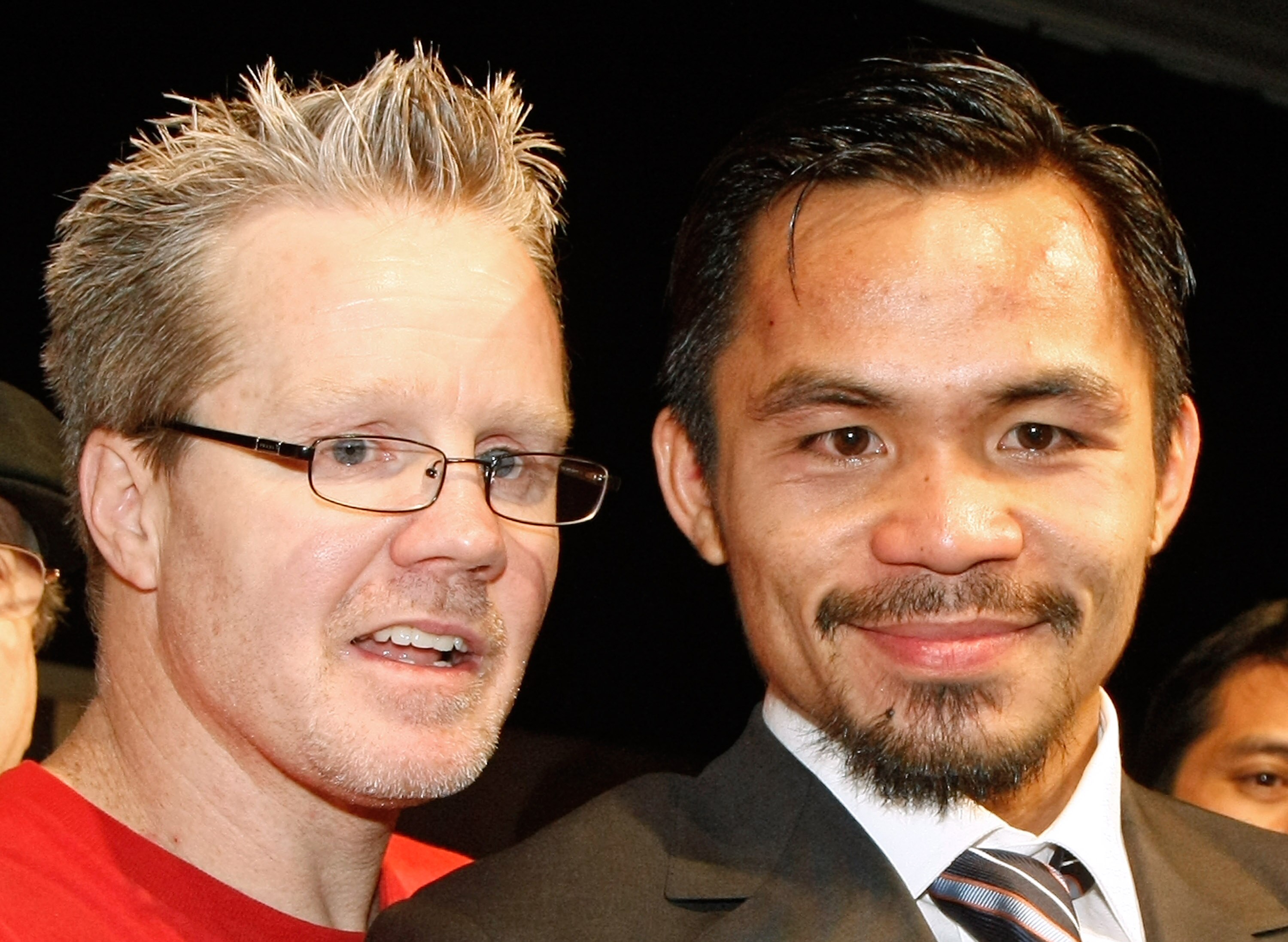 LAS VEGAS - DECEMBER 06:  Manny Pacquiao (R) of the Philippines and his trainer Freddie Roach appear at a news conference following Pacquiao's victory over Oscar De La Hoya in their welterweight bout at the MGM Grand Garden Arena December 6, 2008 in Las V