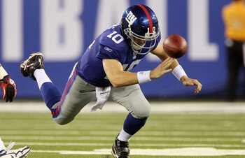 EAST RUTHERFORD, NJ - SEPTEMBER 02:  Eli Manning #10 of the New York Giants fumbles the ball in the first quarter against the New England Patriots on September 2, 2010 at the New Meadowlands Stadium in East Rutherford, New Jersey.  (Photo by Jim McIsaac/G