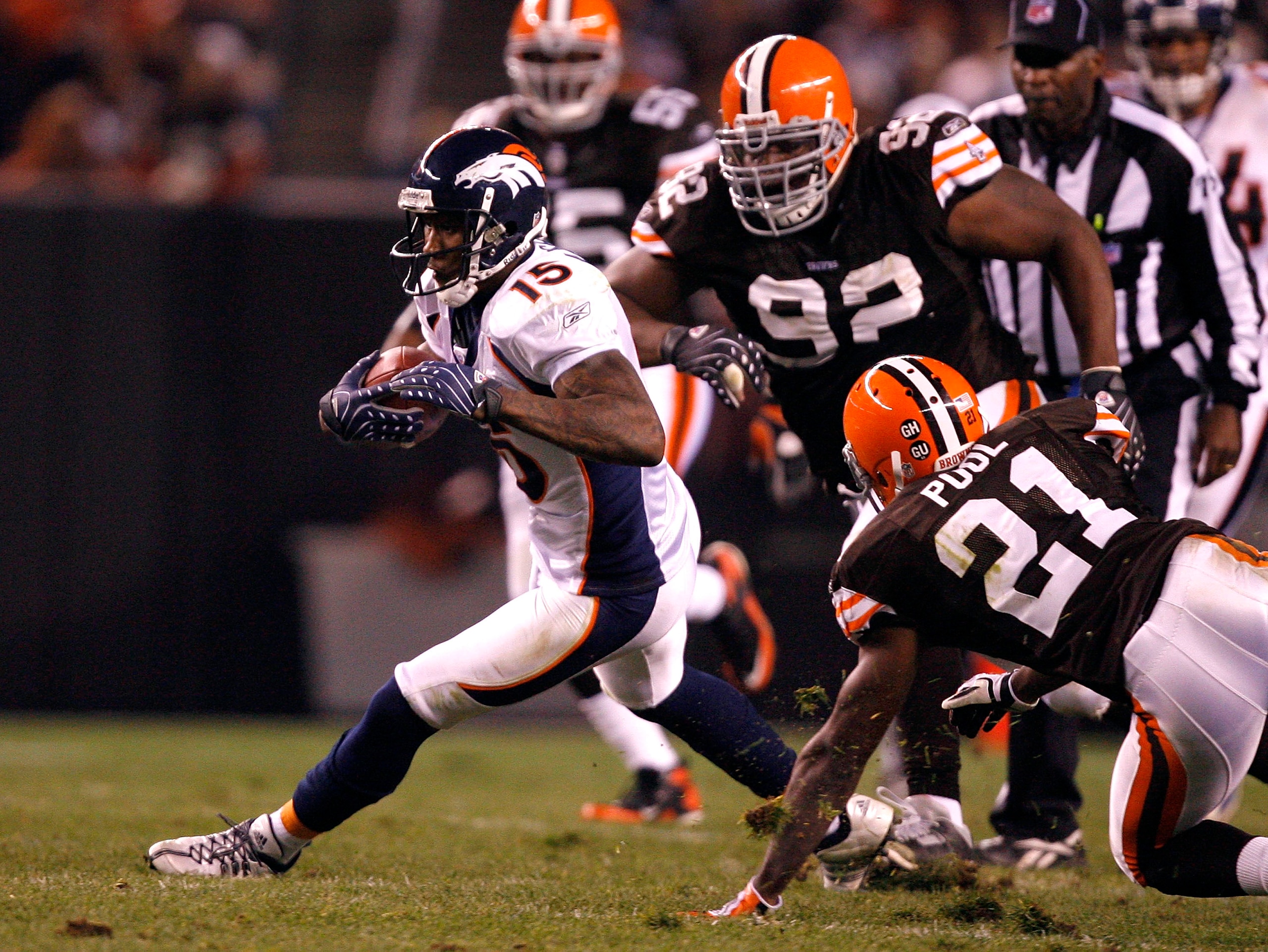 CLEVELAND - NOVEMBER 06:  Brandon Marshall #15 of the Denver Broncos runs by Brodney Pool #21 and Shaun Rogers #92 of the Cleveland Browns during the second quarter of their NFL game at Cleveland Browns Stadium November 6, 2008 in Cleveland, Ohio.  (Photo