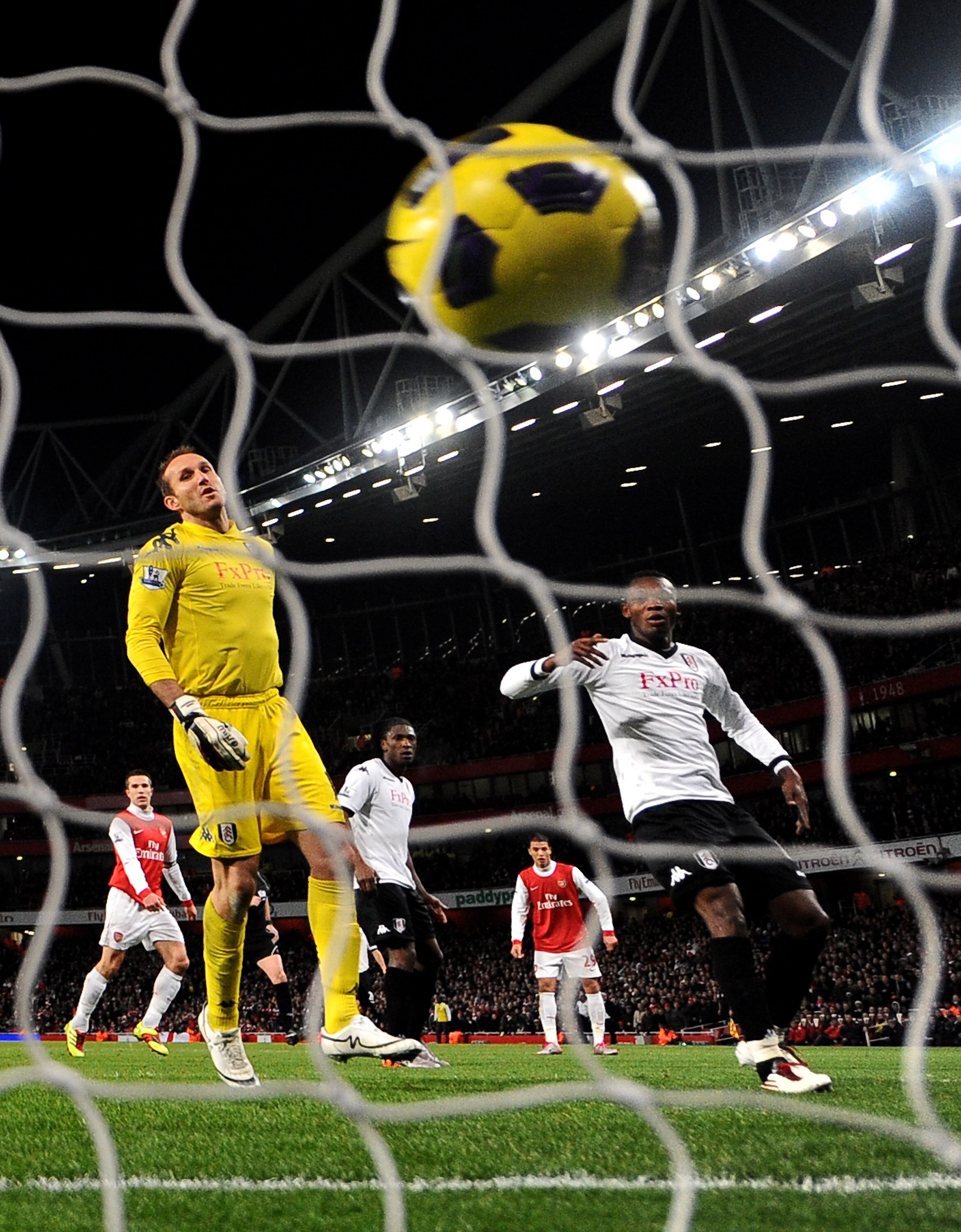 LONDON, ENGLAND - DECEMBER 04: Mark Schwarzer (L) of Fulham looks dejected as Samir Nasri of Arsenal (not pictured) scores the winning goal during the Barclays Premier League match between Arsenal and Fulham at the Emirates Stadium on December 4, 2010 in LONDON, ENGLAND - DECEMBER 04: Mark Schwarzer (L) of Fulham looks dejected as Samir Nasri of Arsenal (not pictured) scores the winning goal during the Barclays Premier League match between Arsenal and Fulham at the Emirates Stadium on December 4, 2010 in