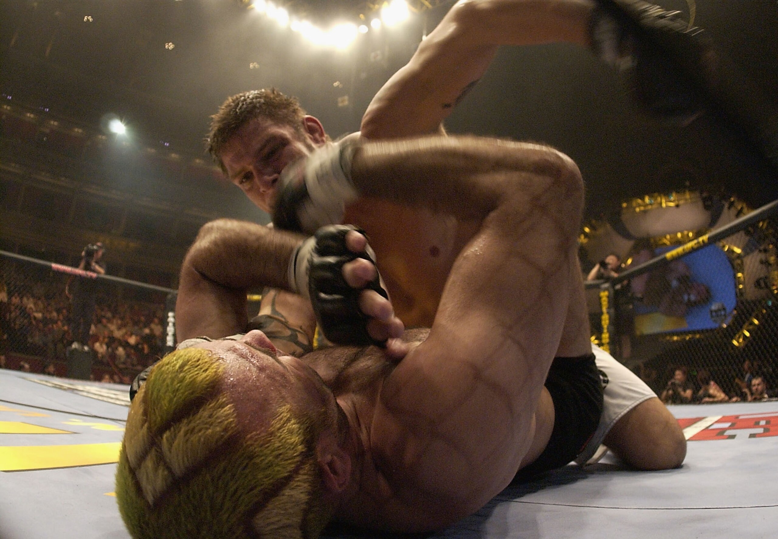 LONDON - JULY 13:  Renato 'Babalu' Sobral of Brazil throws a punch at Elvis Sinosic of Australia during the Ultimate Fighting Championship, 'Brawl in the Royal Albert Hall', in the Royal Albert Hall London, England on July 13, 2002. (Photo by John Gichigi
