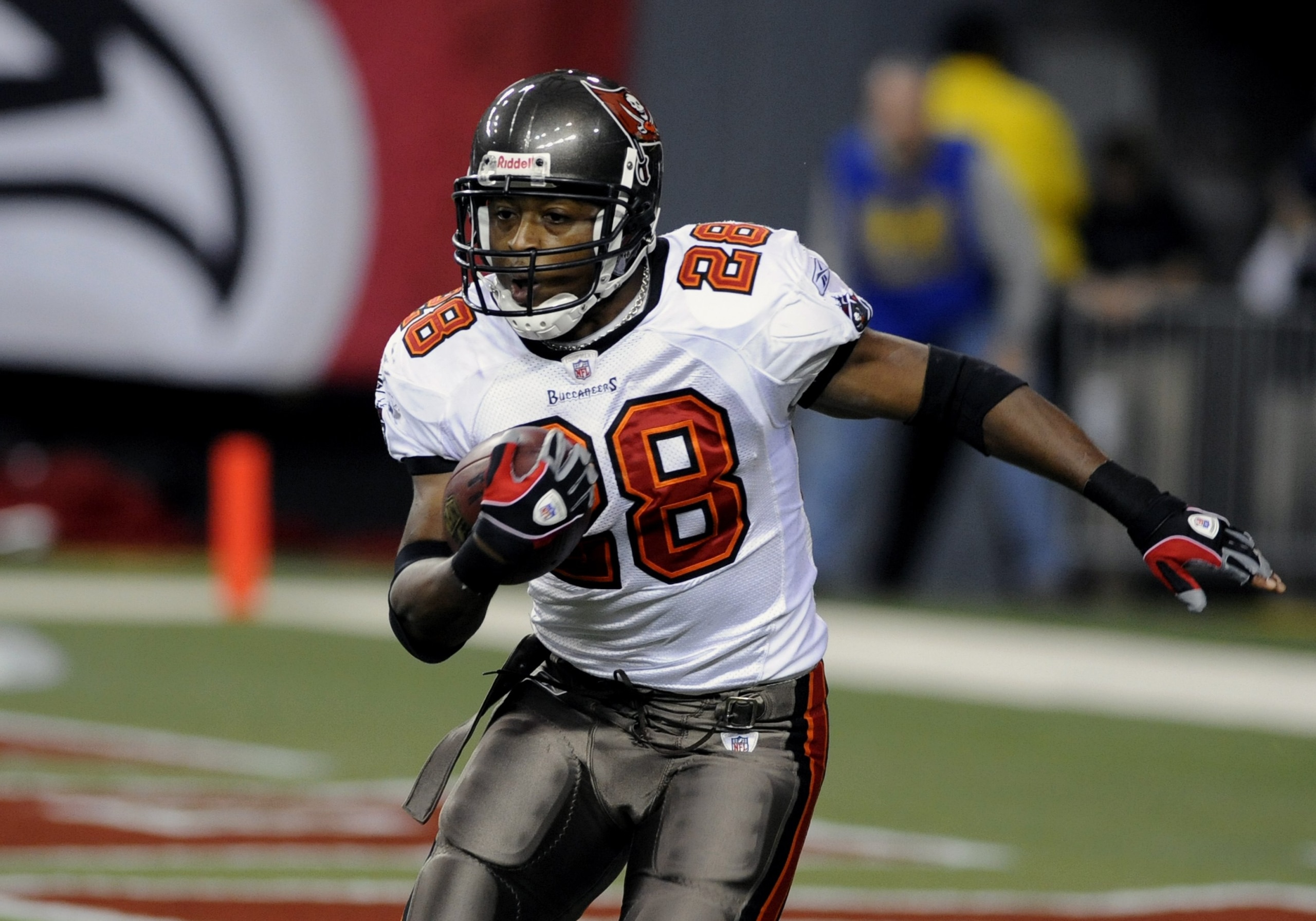 ATLANTA - DECEMBER 14: Running back Warrick Dunn #28 of the Tampa Bay Buccaneers rushes upfield against the Atlanta Falcons at the Georgia Dome on December 14, 2008 in Atlanta, Georgia. (Photo by Al Messerschmidt/Getty Images) ATLANTA - DECEMBER 14: Running back Warrick Dunn #28 of the Tampa Bay Buccaneers rushes upfield against the Atlanta Falcons at the Georgia Dome on December 14, 2008 in Atlanta, Georgia. (Photo by Al Messerschmidt/Getty Images)