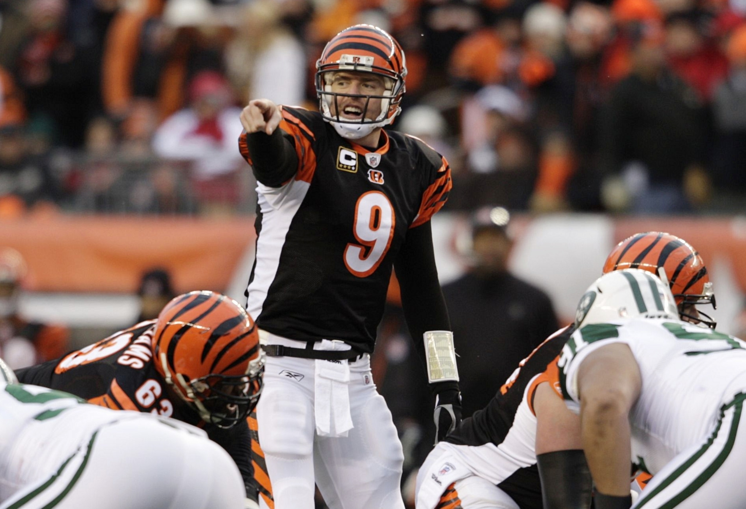 CINCINNATI - JANUARY 9:  Quarterback Carson Palmer #9 of the Cincinnati Bengals signals at the line of scrimmage against the New York Jets during the 2010 AFC wild-card playoff game at Paul Brown Stadium on January 9, 2010 in Cincinnati, Ohio. (Photo by A