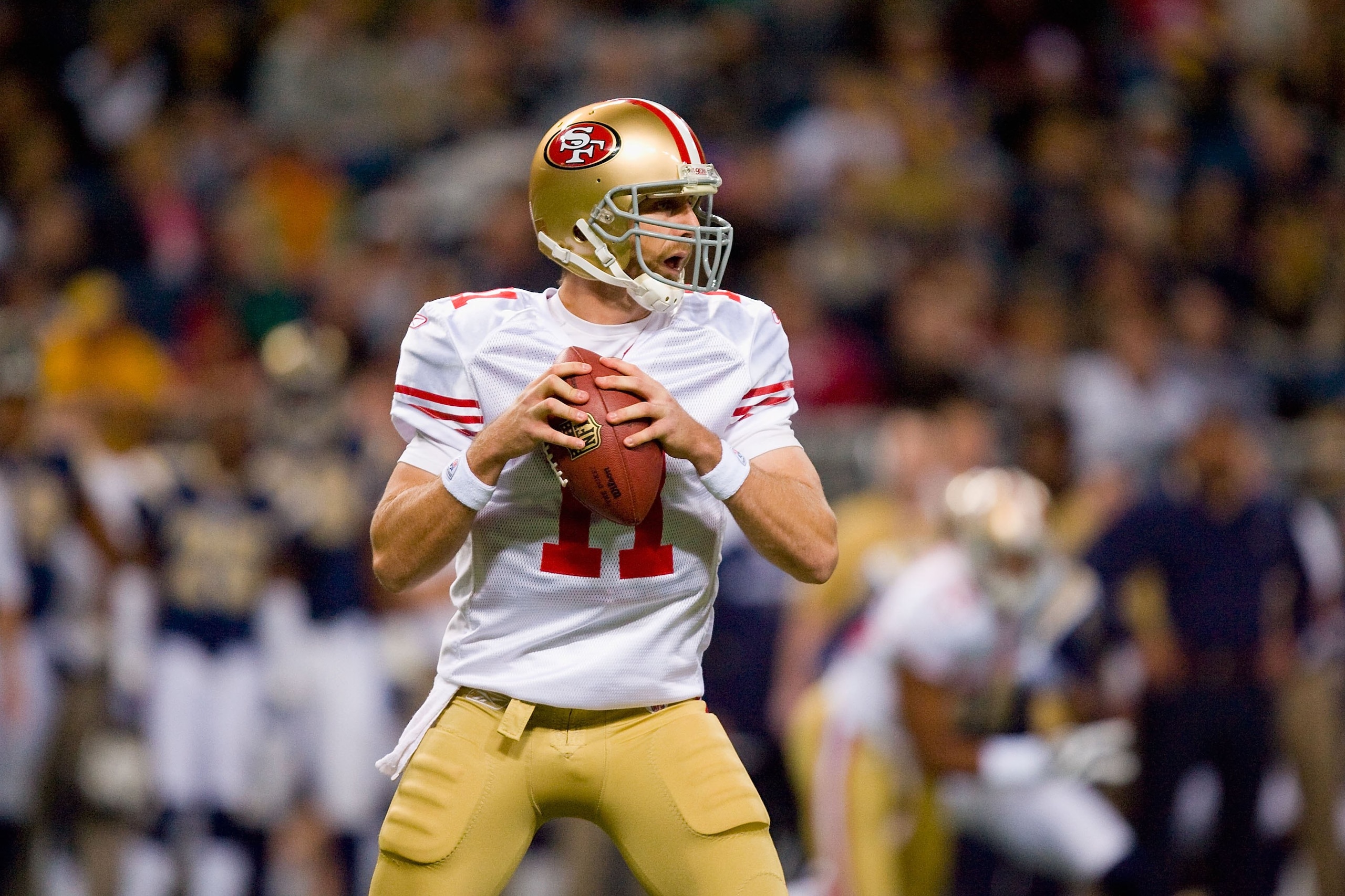 ST. LOUIS - JANUARY 3: Quarterback Alex Smith #11 of the San Francisco 49ers looks to pass the ball during the game against the St. Louis Rams at the Edward Jones Dome on January 3, 2010 in St. Louis, Missouri.  The 49ers beat the Rams 28-6.  (Photo by Di