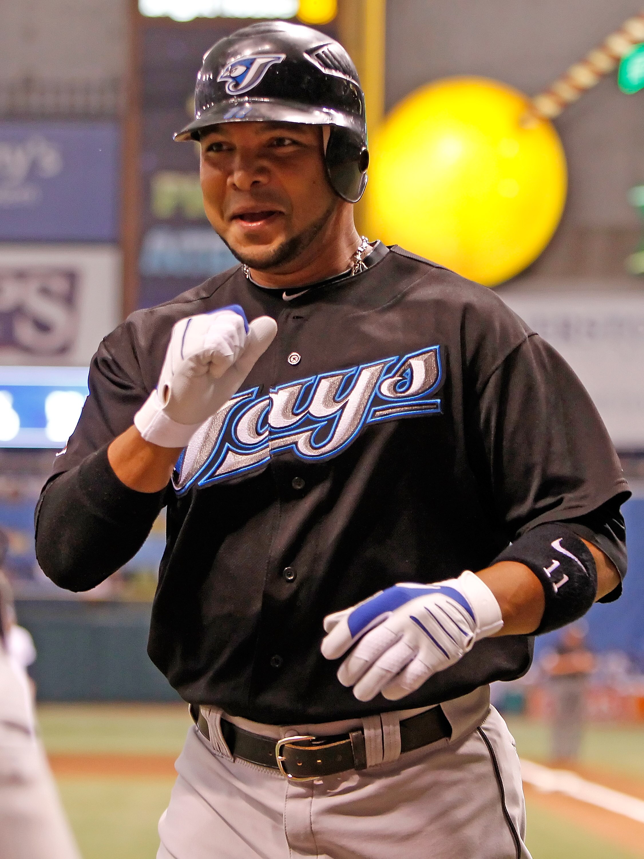 ST. PETERSBURG - JUNE 10:  Infielder Alex Gonzalez #11 of the Toronto Blue Jays celebrates his home run against the Tampa Bay Rays during the game at Tropicana Field on June 10, 2010 in St. Petersburg, Florida.  (Photo by J. Meric/Getty Images)