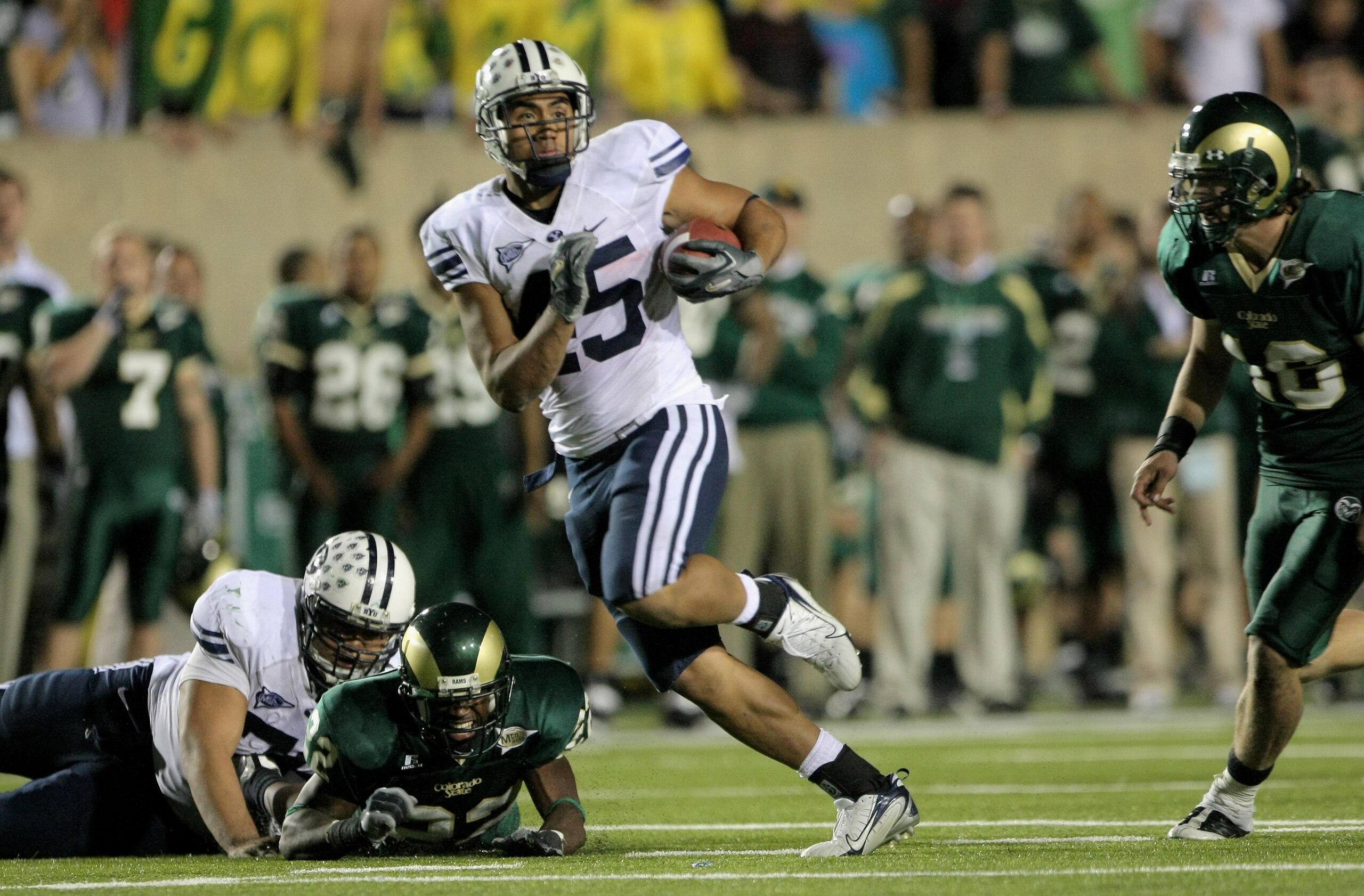 FORT COLLINS, CO - NOVEMBER 01: Harvey Unga #45 of the Brigham Young Cougars rushes for a 40 yard fourth quarter touchdown against the Colorado State Rams at Sonny Lubick Field at Hughes Stadium on November 1, 2008 in Fort Collins, Colorado. BYU defeated FORT COLLINS, CO - NOVEMBER 01: Harvey Unga #45 of the Brigham Young Cougars rushes for a 40 yard fourth quarter touchdown against the Colorado State Rams at Sonny Lubick Field at Hughes Stadium on November 1, 2008 in Fort Collins, Colorado. BYU defeated