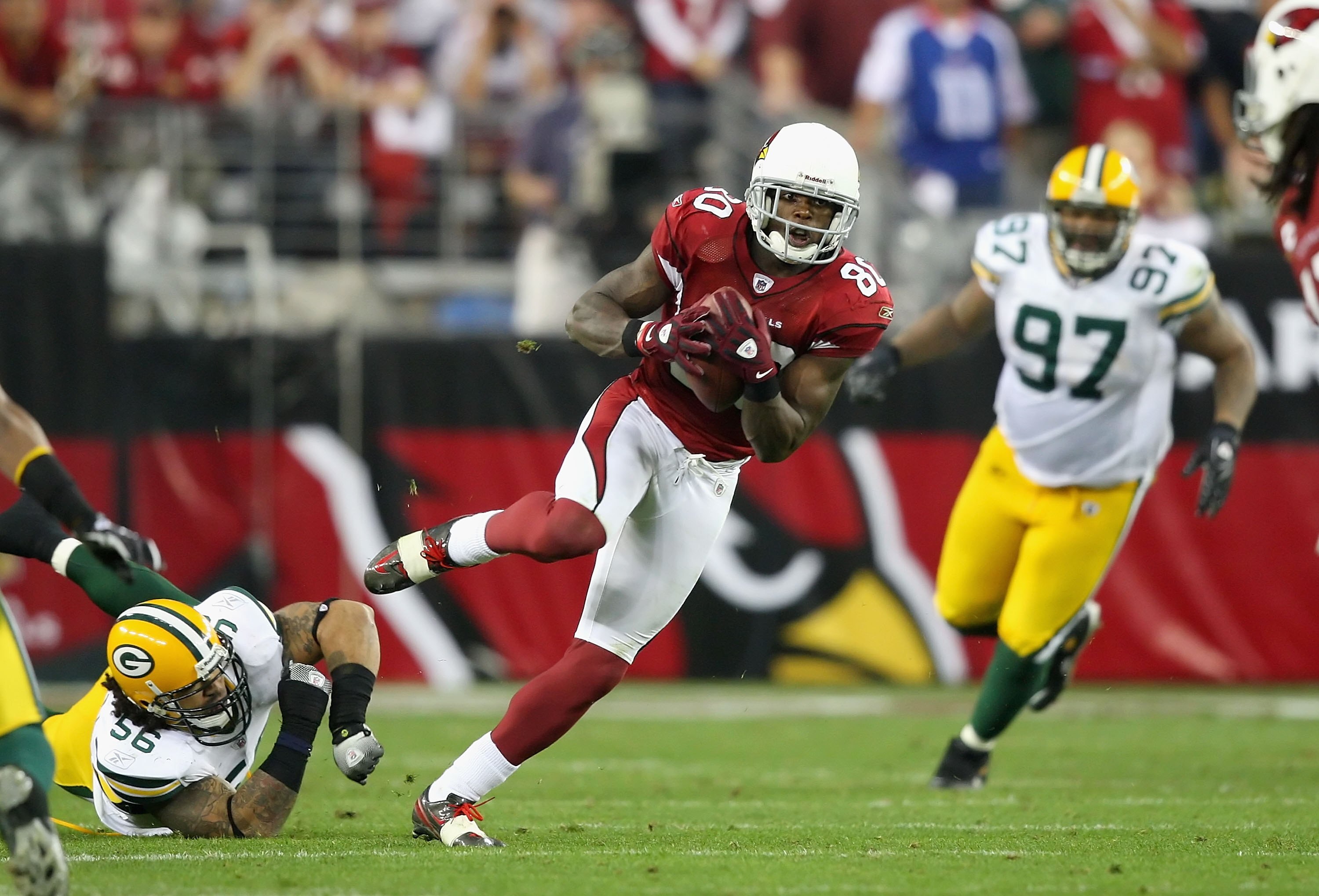 GLENDALE, AZ - JANUARY 10:  Wide receiver Early Doucet #80 of the Arizona Cardinals runs with the football during the 2010 NFC wild-card playoff game against  the Green Bay Packers at the Universtity of Phoenix Stadium on January 10, 2010 in Glendale, Ari