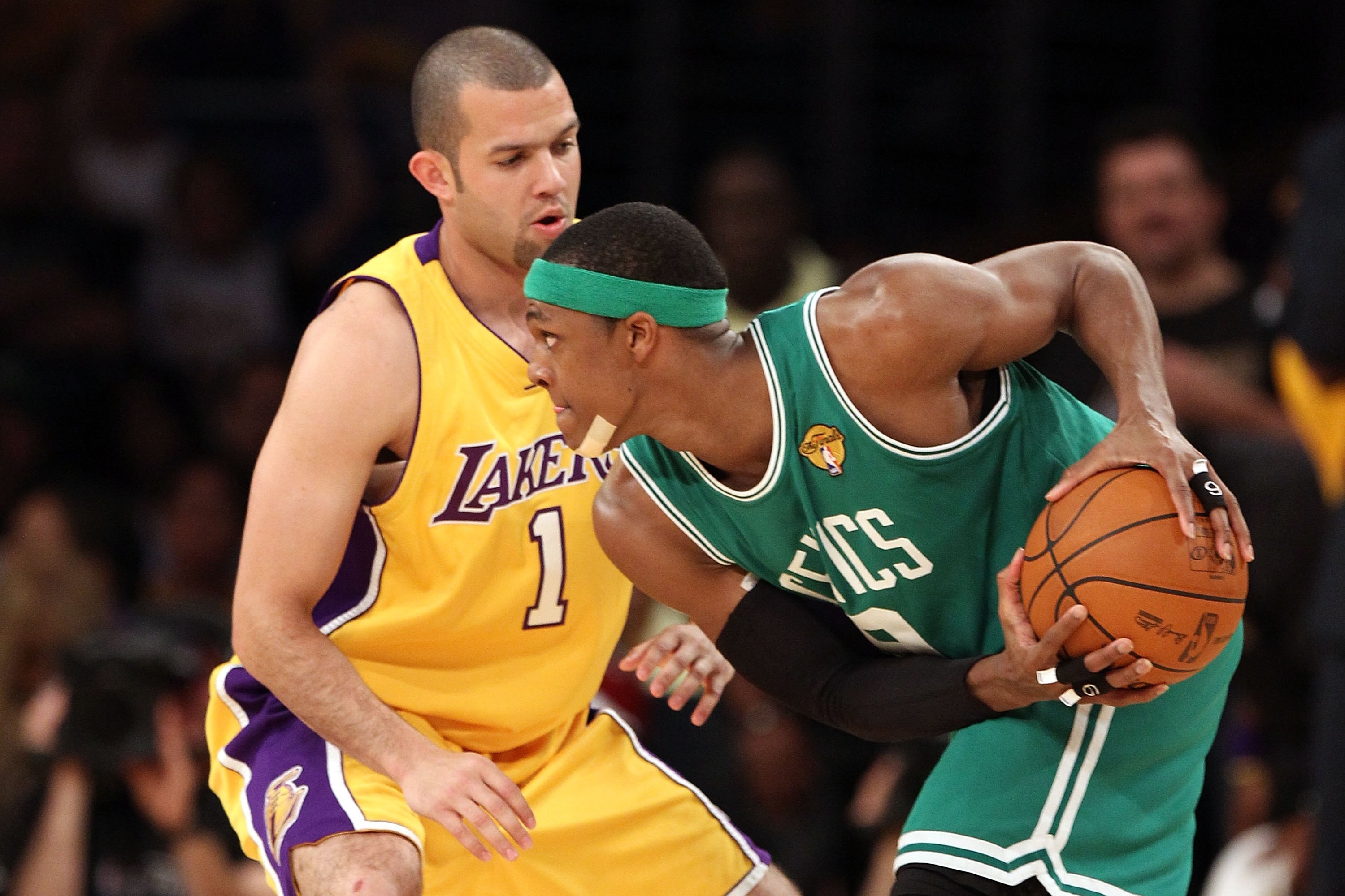 LOS ANGELES, CA - JUNE 17:  Rajon Rondo #9 of the Boston Celtics looks looks to move the ball as he is guarded by Jordan Farmar #1 of the Los Angeles Lakers in Game Seven of the 2010 NBA Finals at Staples Center on June 17, 2010 in Los Angeles, California