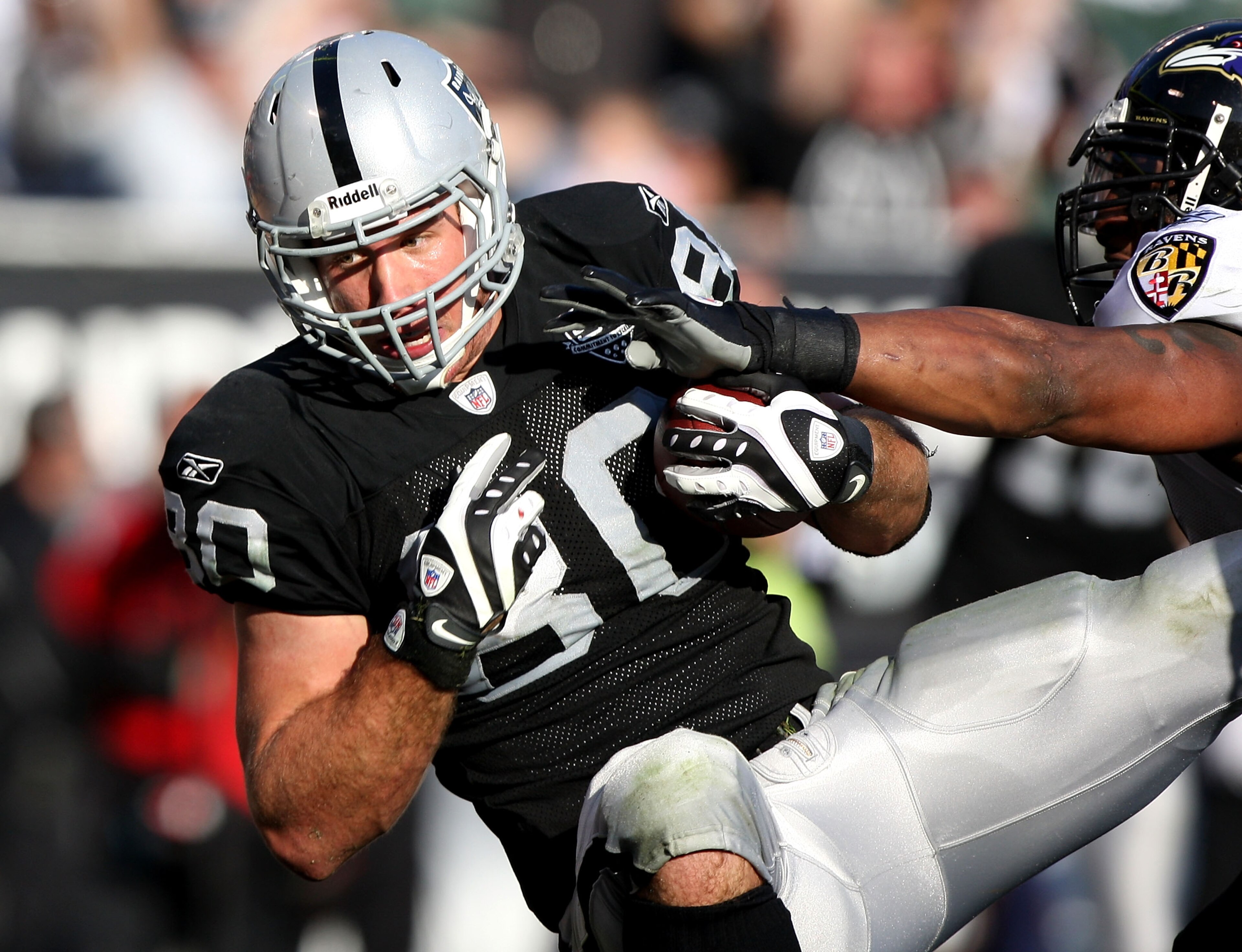 OAKLAND, CA - JANUARY 03: Zach Miller #80 of the Oakland Raiders catches a touchdown pass in the second quarter against the Baltimore Ravens during an NFL game at Oakland-Alameda County Coliseum on January 3, 2010 in Oakland, California.  (Photo by Jed Ja