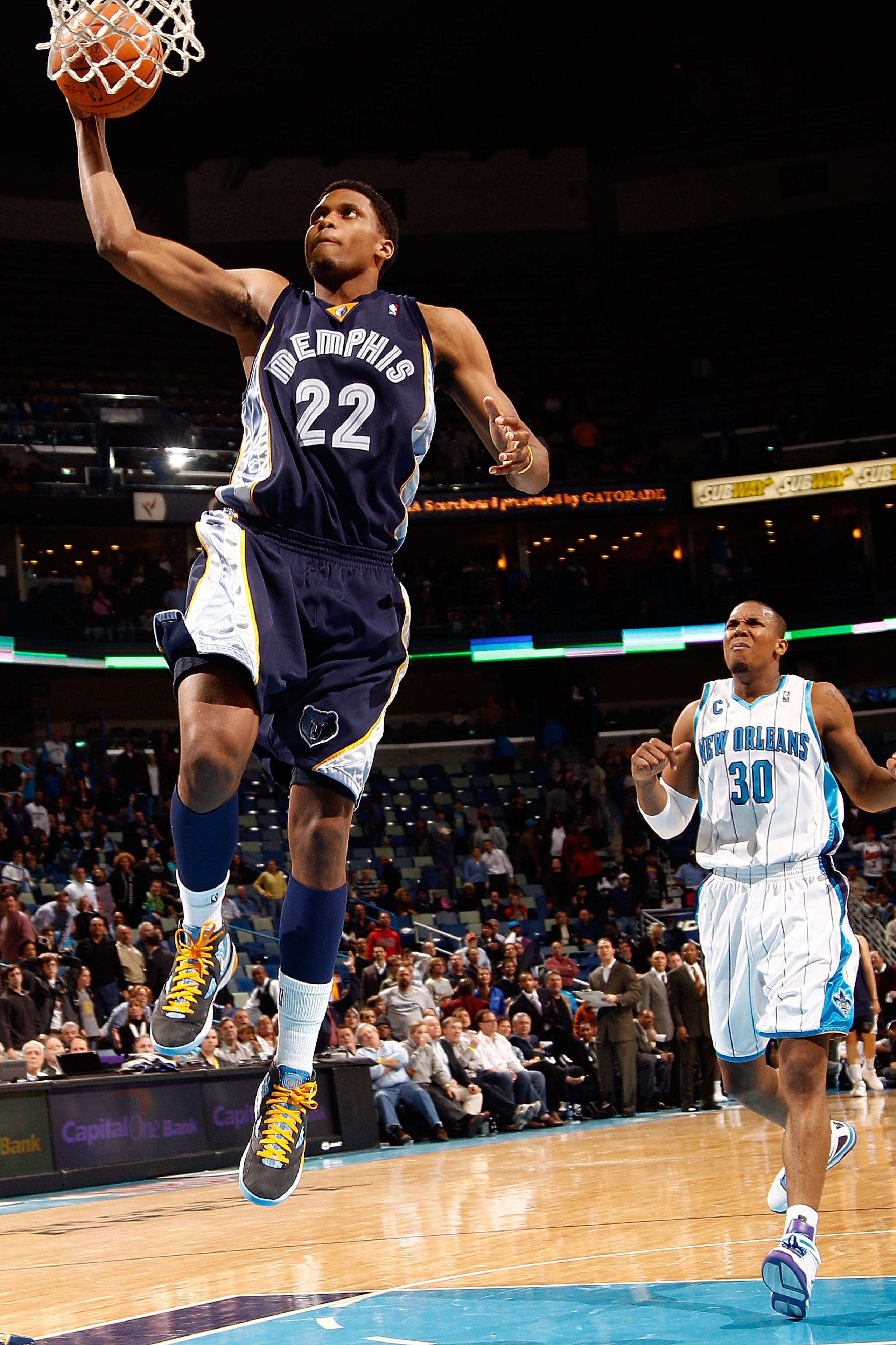 NEW ORLEANS - MARCH 03:  Rudy Gay #22 of the Memphis Grizzlies dunks the ball over David West #30 of the New Orleans Hornets to end the game at the New Orleans Arena on March 3, 2010 in New Orleans, Louisiana.  The Grizzlies defeated the Hornets 104-100.