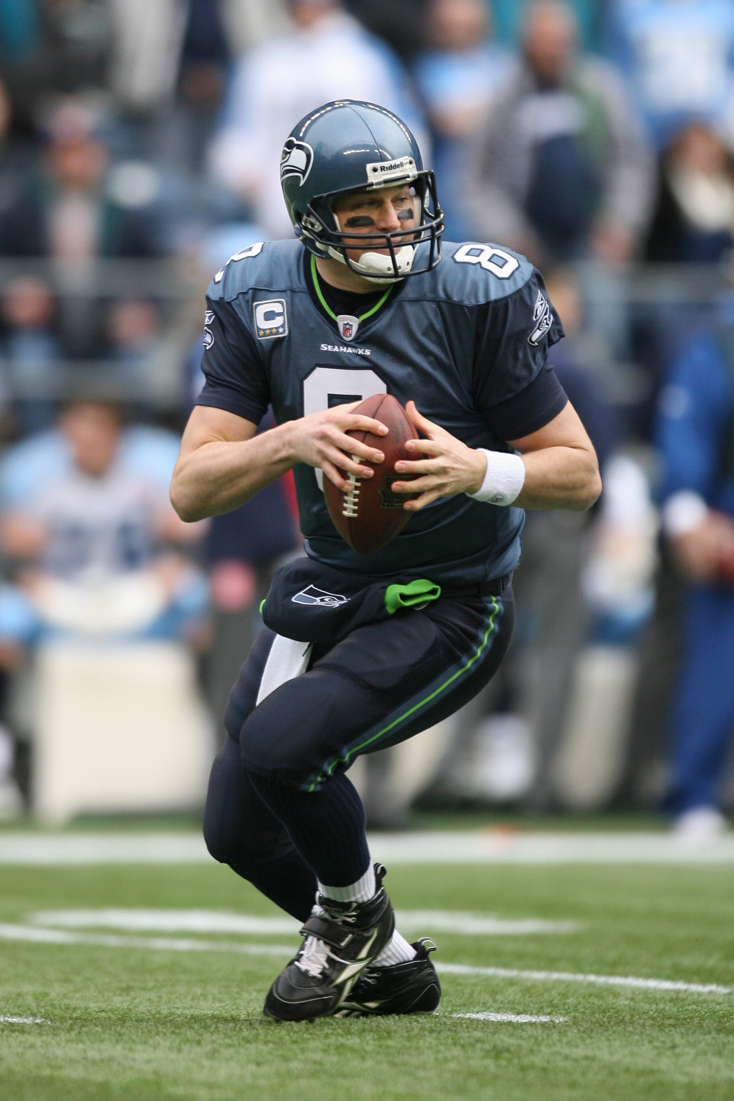 SEATTLE - JANUARY 03:  Matt Hasselbeck #8 of the Seattle Seahawks looks for a receiver during the game against the Tennessee Titans on January 3, 2010 at Qwest Field in Seattle, Washington. (Photo by Otto Greule Jr/Getty Images)