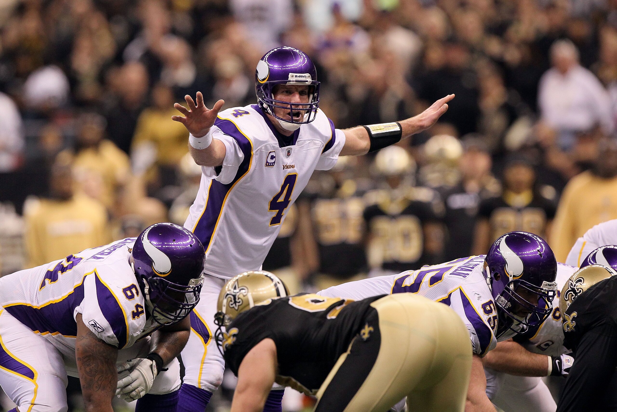 NEW ORLEANS - JANUARY 24: Brett Favre #4 of the Minnesota Vikings gestures as he steps to the line of scrimmage against the New Orleans Saints during the NFC Championship Game at the Louisiana Superdome on January 24, 2010 in New Orleans, Louisiana. The NEW ORLEANS - JANUARY 24: Brett Favre #4 of the Minnesota Vikings gestures as he steps to the line of scrimmage against the New Orleans Saints during the NFC Championship Game at the Louisiana Superdome on January 24, 2010 in New Orleans, Louisiana. The