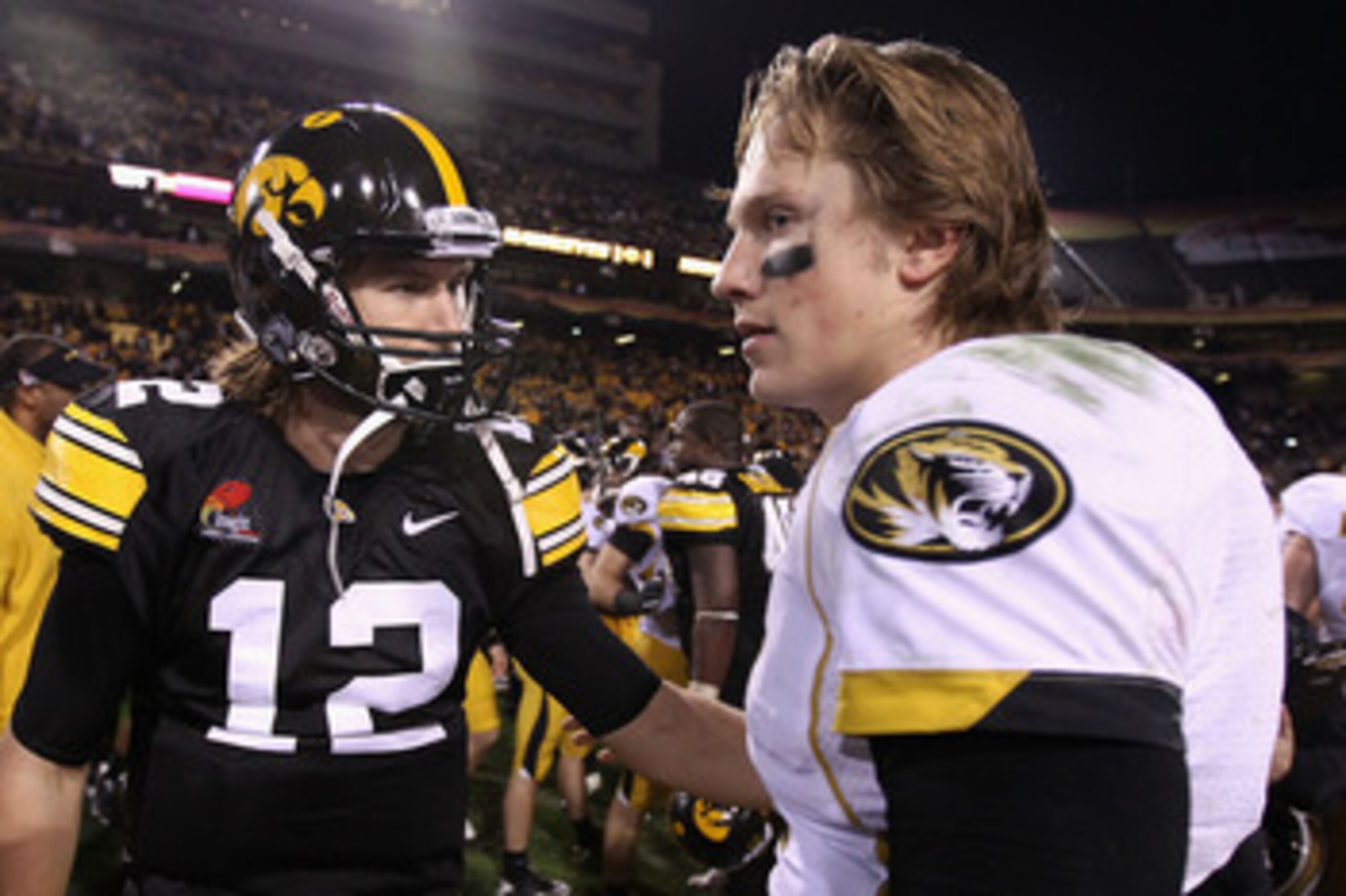 TEMPE, AZ - DECEMBER 28:  Quarterback Ricky Stanzi #12 of the Iowa Hawkeyes greets Blaine Gabbert #11 of the Missouri Tigers following the Insight Bowl at Sun Devil Stadium on December 28, 2010 in Tempe, Arizona. The Hawkeyes defeated the Tigers 27-24.  (