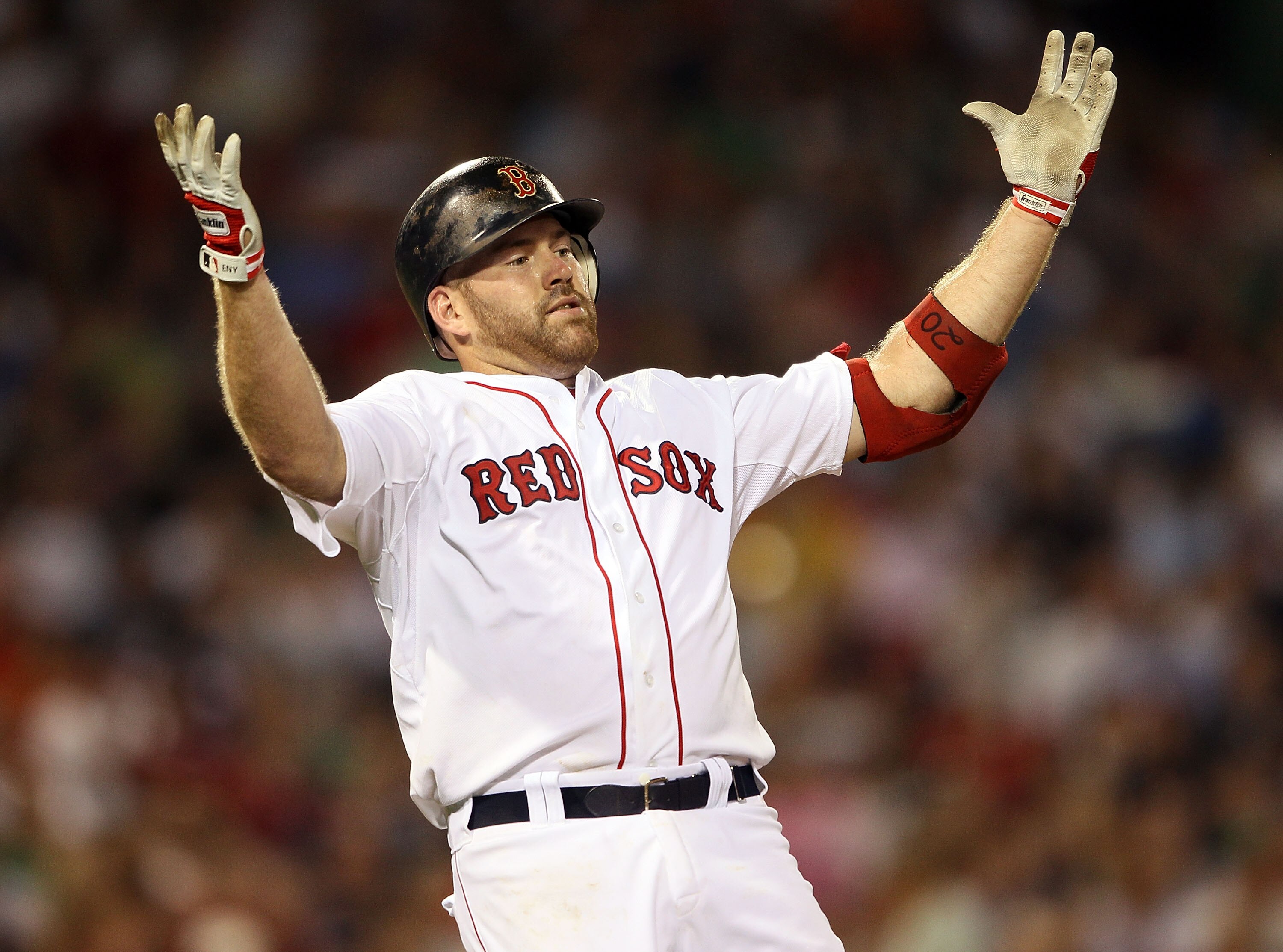 BOSTON - JULY 15:  Kevin Youkilis #20 of the Boston Red Sox reacts after he hit a pop fly out in the sixth inning against the Texas Rangers on July 15, 2010 at Fenway Park in Boston, Massachusetts.  (Photo by Elsa/Getty Images)