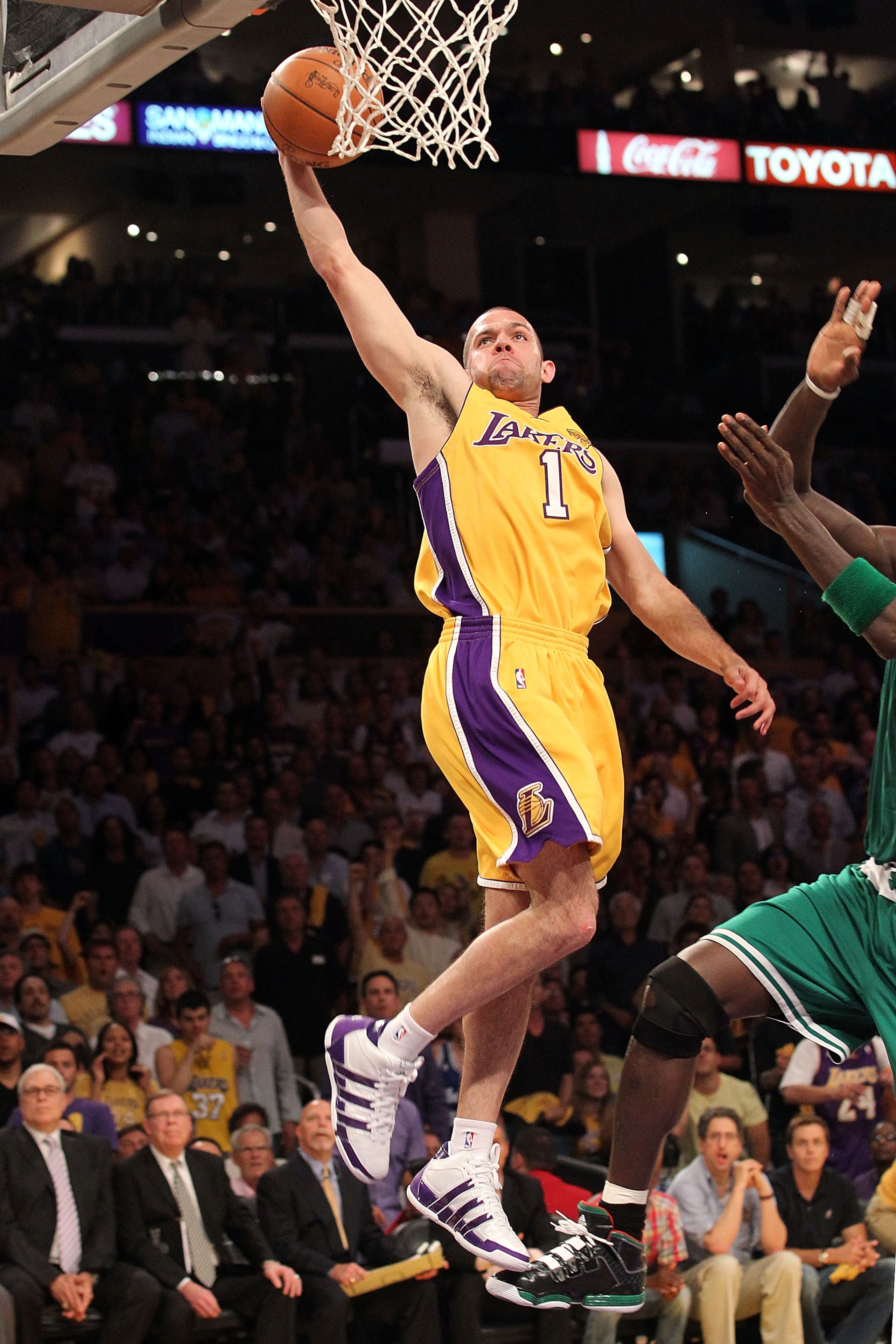 LOS ANGELES, CA - JUNE 15:  Jordan Farmar #1 of the Los Angeles Lakers dunks the ball in front of Kevin Garnett #5 of the Boston Celtics in Game Six of the 2010 NBA Finals at Staples Center on June 15, 2010 in Los Angeles, California.  NOTE TO USER: User