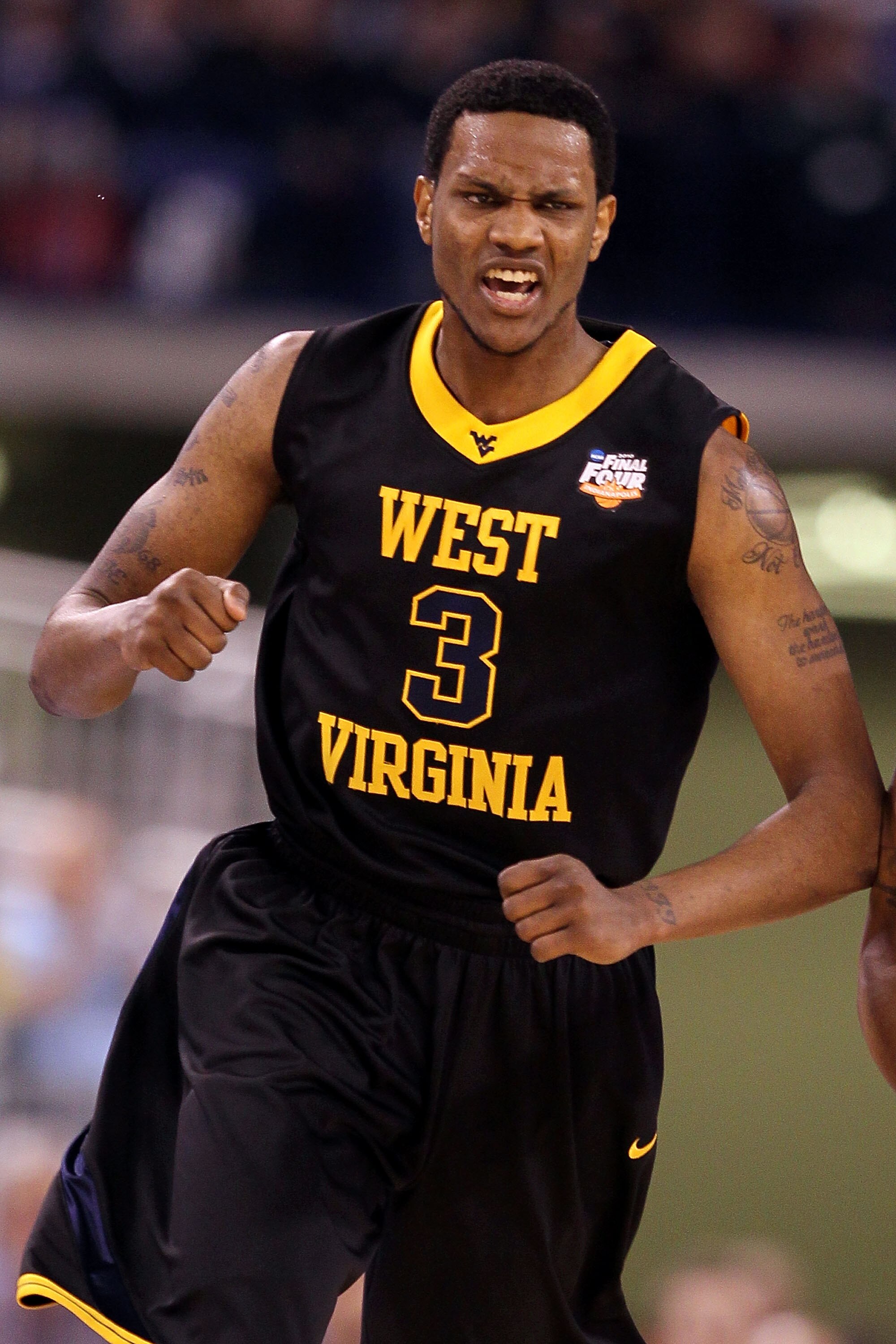 INDIANAPOLIS - APRIL 03:  Devin Ebanks #3 of the West Virginia Mountaineers reacts in the first half against the Duke Blue Devils during the National Semifinal game of the 2010 NCAA Division I Men's Basketball Championship at Lucas Oil Stadium on April 3,
