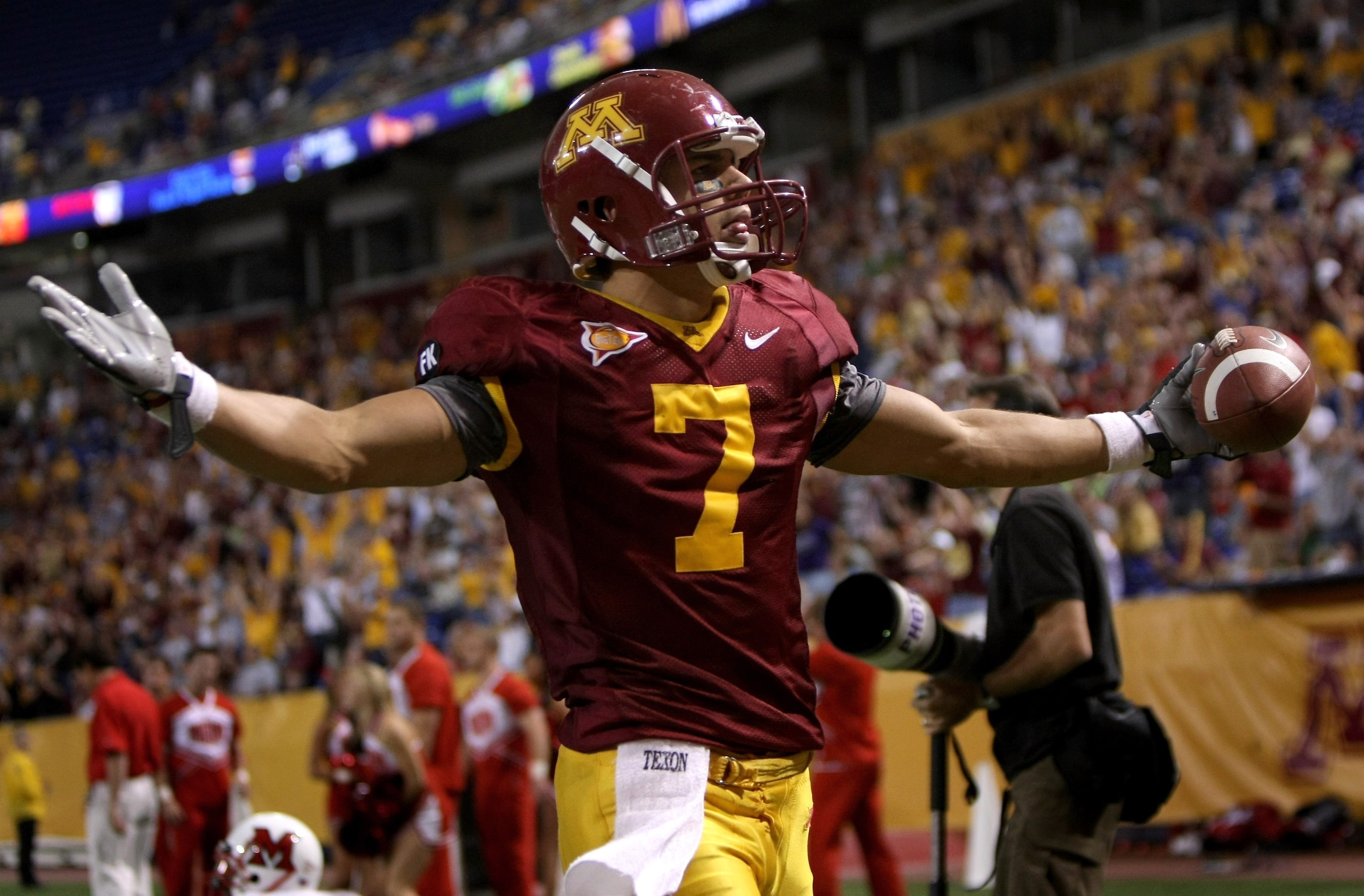 MINNEAPOLIS, MN - SEPTEMBER 08:  Eric Decker #7 of the Minnesota Golden Gophers celebrates his touchdown reception in the first overtime period against the Miami of Ohio Redhawks as Minnesota defeated Miami of Ohio 41-35 in triple overtime at the Metrodom