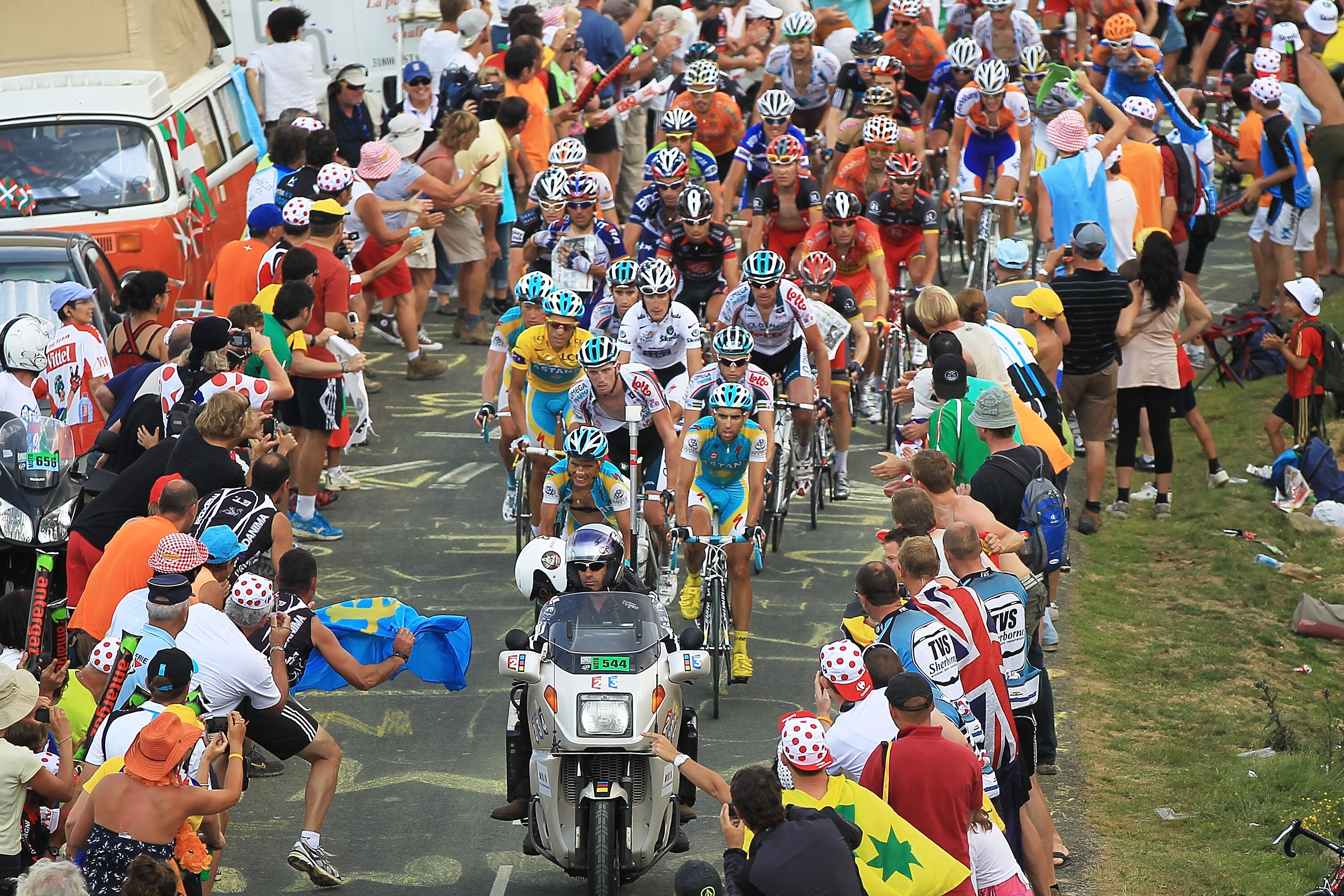 PAU, FRANCE - JULY 20: Thousands cheer on the peloton as they come to the top of the Col du Tourmalet during stage 16 of the Tour de France on July 20, 2010 in Pau, France. The stage, between Bagneres-de-Luchon and Pau, featured four major climbs includin