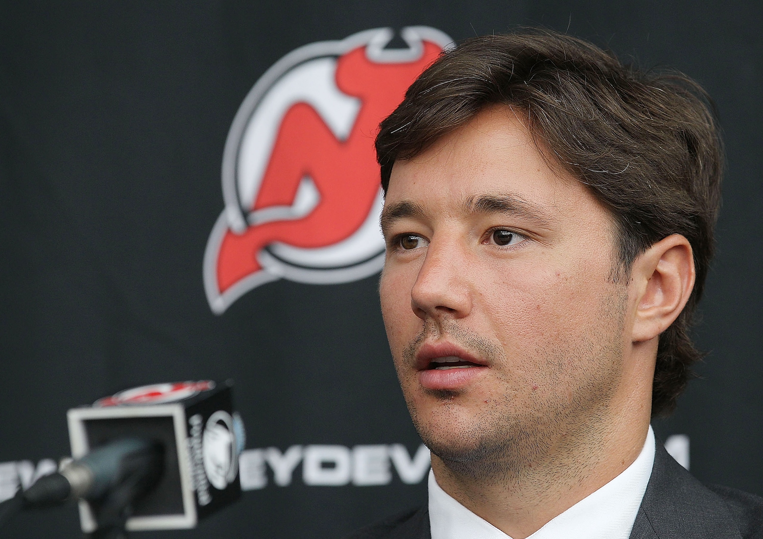 NEWARK, NJ - JULY 20:  Ilya Kovalchuk of the New Jersey Devils speaks with the media after announcing his contract renewal at the Prudential Center on July 20, 2010 in Newark, New Jersey.  (Photo by Bruce Bennett/Getty Images)
