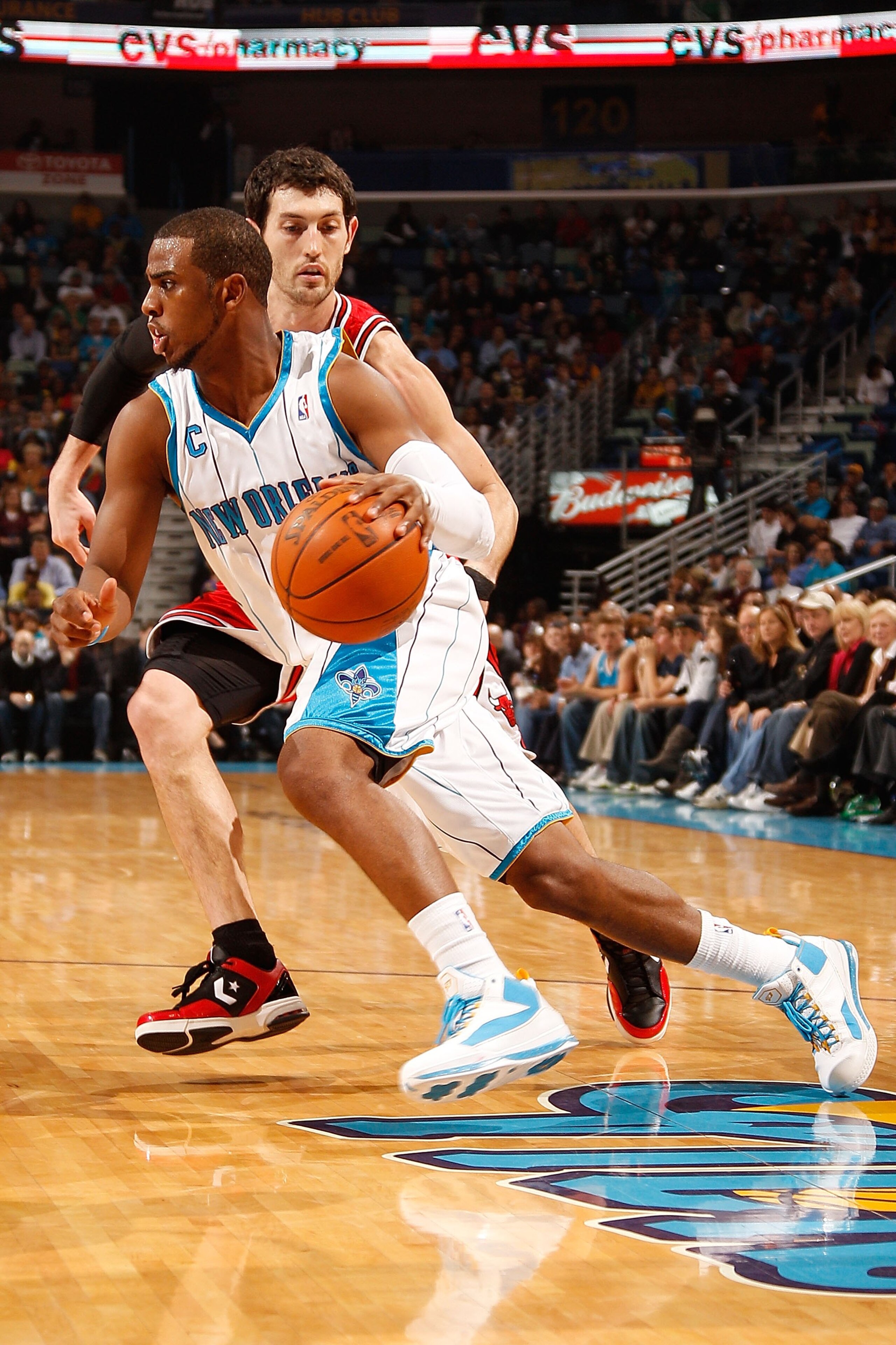 NEW ORLEANS - JANUARY 29: Chris Paul #3 of the New Orleans Hornets drives the ball around Kirk Hinrich #12 of the Chicago Bulls at the New Orleans Arena on January 29, 2010 in New Orleans, Louisiana. NOTE TO USER: User expressly acknowledges and agrees NEW ORLEANS - JANUARY 29: Chris Paul #3 of the New Orleans Hornets drives the ball around Kirk Hinrich #12 of the Chicago Bulls at the New Orleans Arena on January 29, 2010 in New Orleans, Louisiana. NOTE TO USER: User expressly acknowledges and agrees