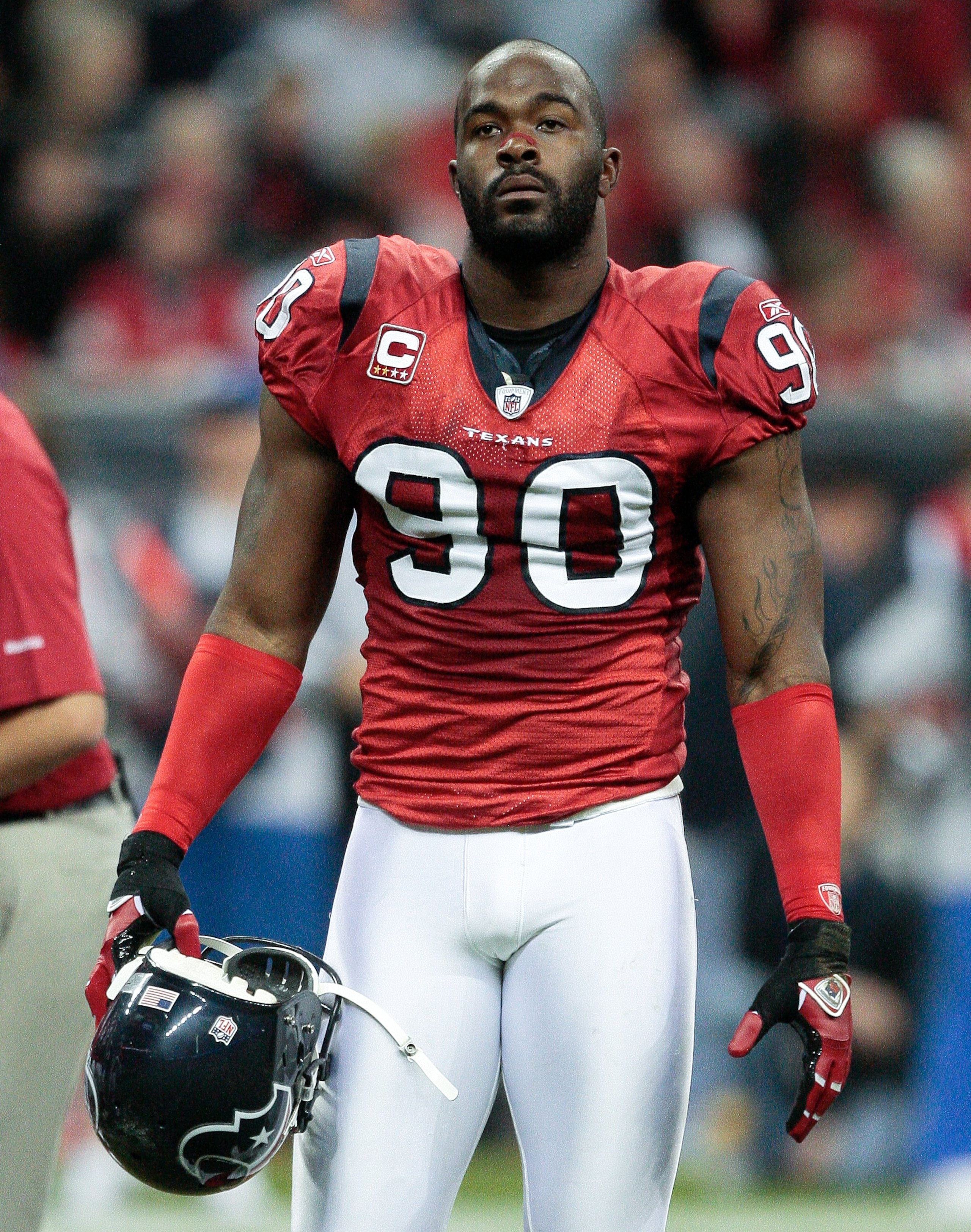 HOUSTON - NOVEMBER 23:  Defensive end Mario Williams #90 of the Houston Texans walks back to the locker room after pre-game warm ups at Reliant Stadium on November 23, 2009 in Houston, Texas.  (Photo by Bob Levey/Getty Images)