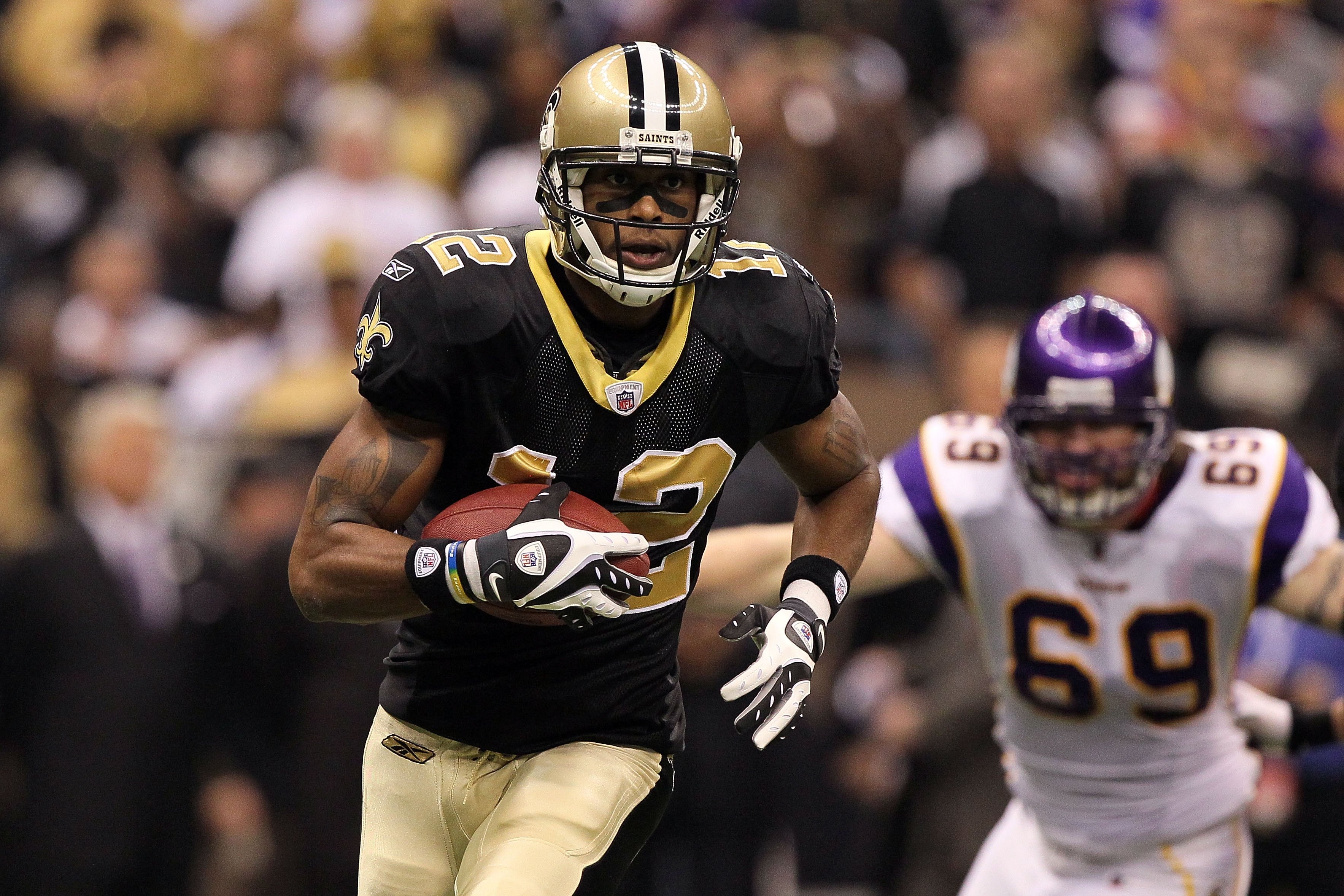 NEW ORLEANS - JANUARY 24:  Marques Colston #12 of the New Orleans Saints runs the ball on a double reverse play against the Minnesota Vikings during the NFC Championship Game at the Louisana Superdome on January 24, 2010 in New Orleans, Louisiana. The Sai