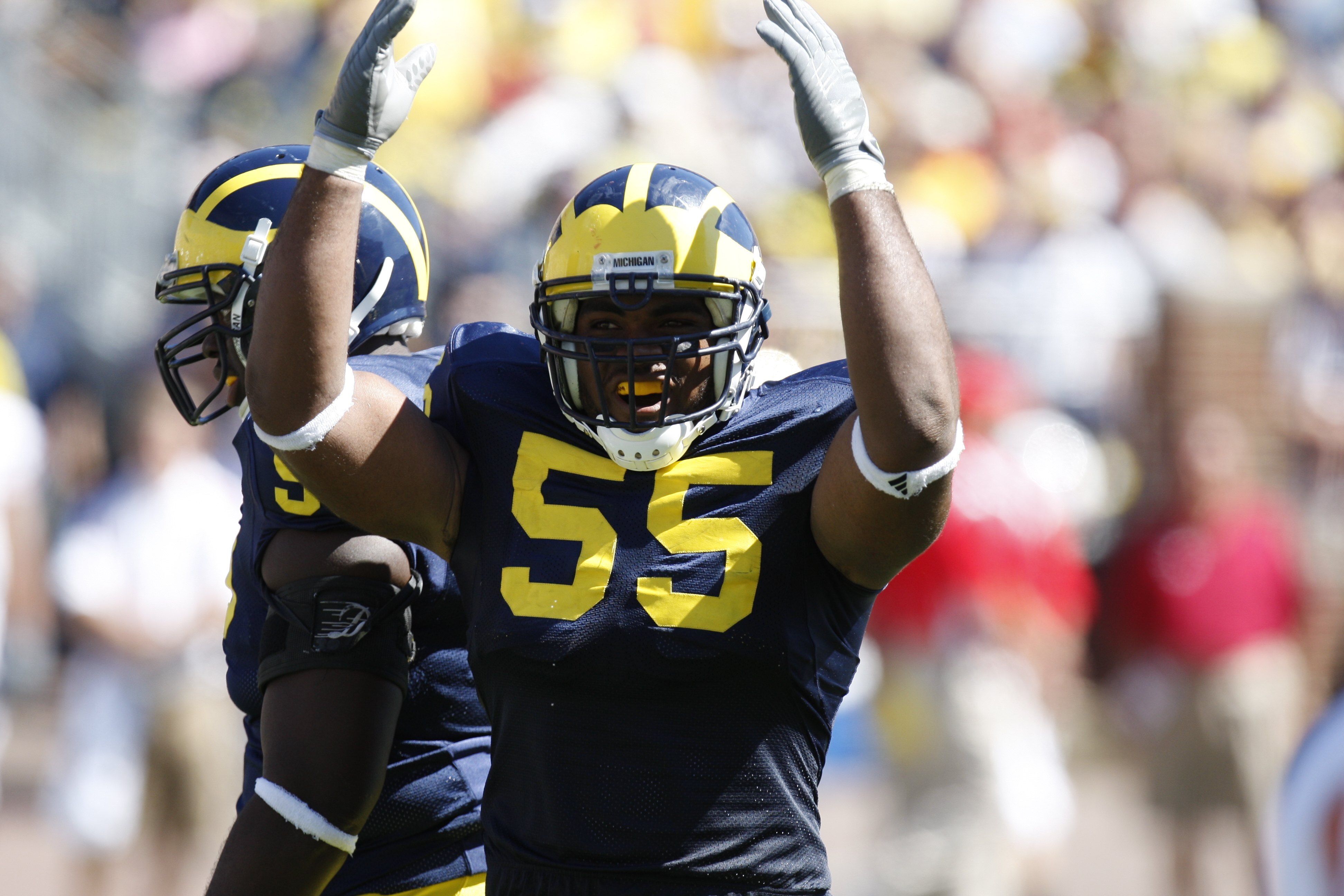 ANN ARBOR, MI - SEPTEMBER 6:  Defensive end Brandon Graham #55 of the Michigan Wolverines raises his arms during the game against the Miami of Ohio Red Hawks on September 6, 2008 at Michigan Stadium in Ann Arbor, Michigan.  The Wolverines defeated the Red