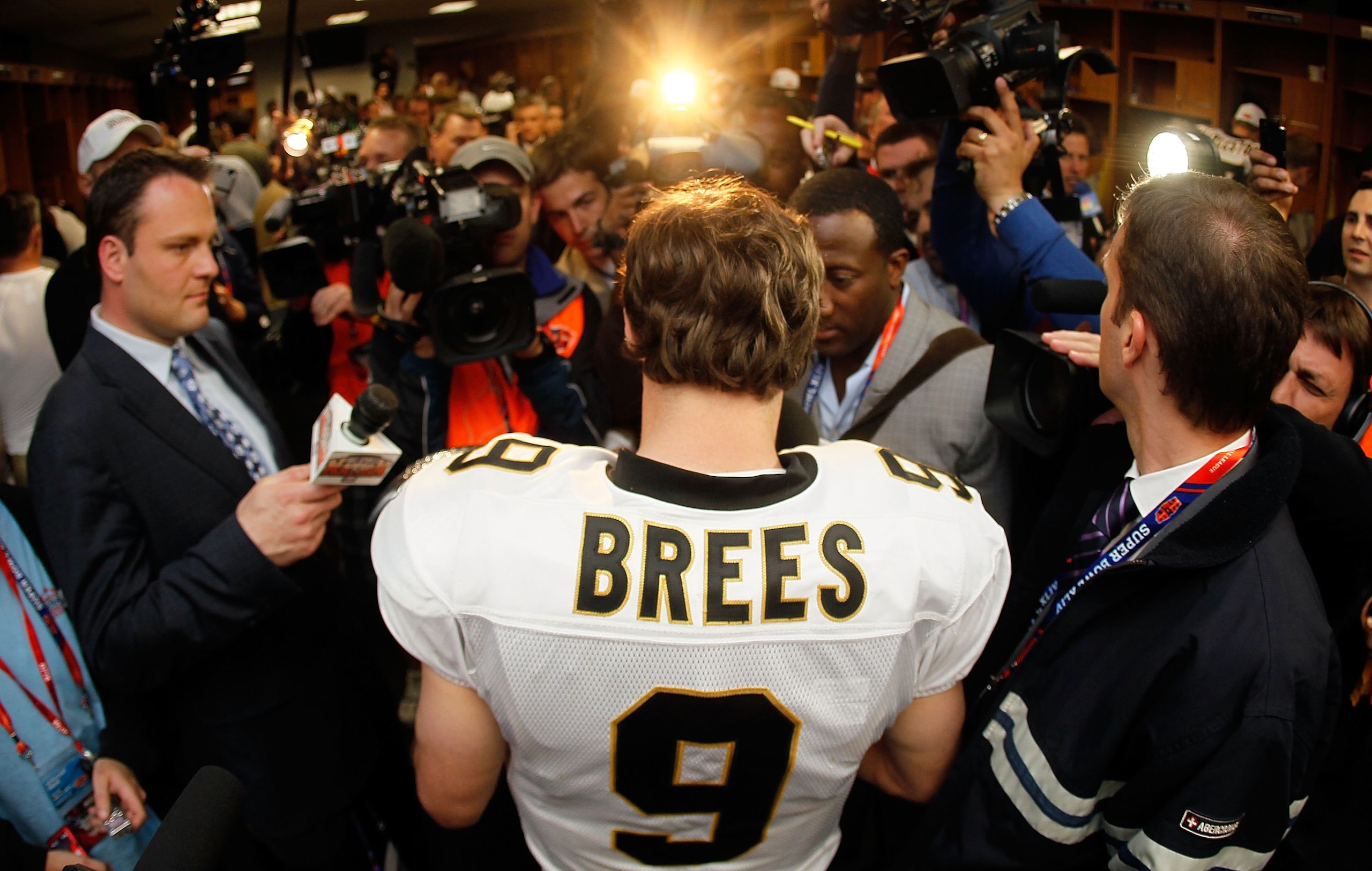 MIAMI GARDENS, FL - FEBRUARY 07:  Drew Brees #9 of the New Orleans Saints is interviewed in the locker room after defeating the Indianapolis Colts during Super Bowl XLIV on February 7, 2010 at Sun Life Stadium in Miami Gardens, Florida.  (Photo by Donald 