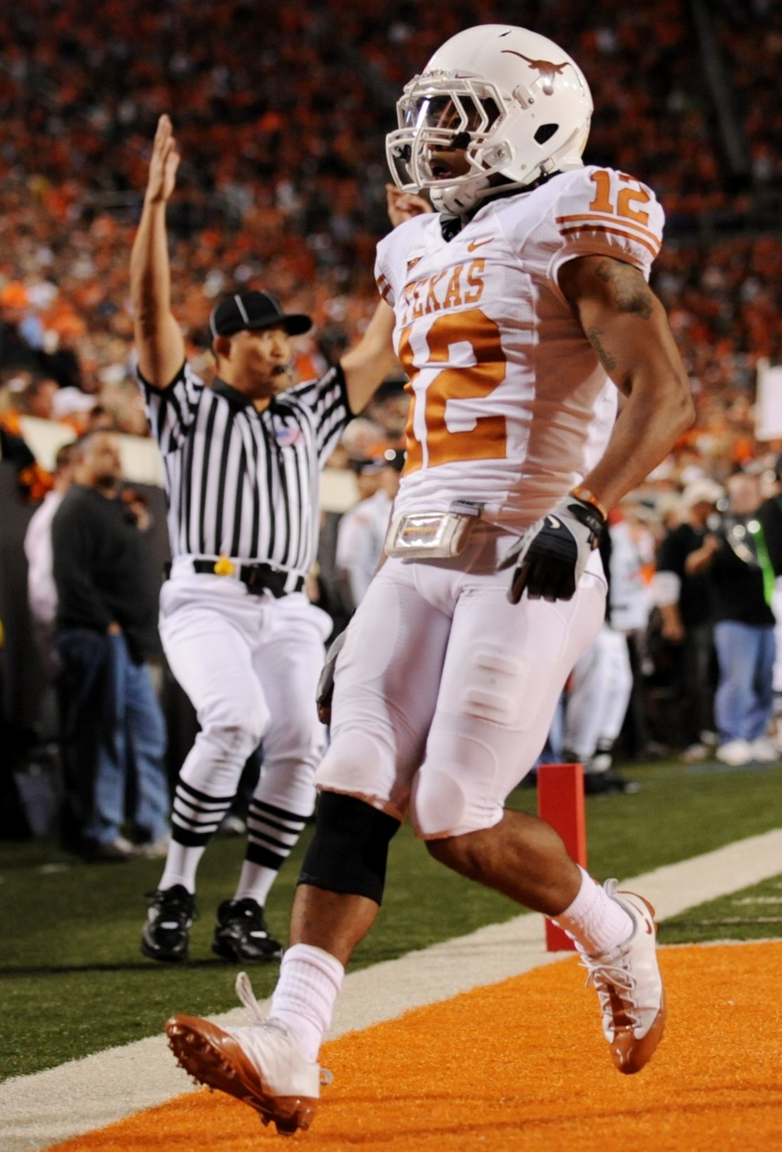 STILLWATER, OK - OCTOBER 31:  Earl Thomas #12 of the Texas Longhorns runs in to score a touchdown on an interception in the third quarter against the Oklahoma State Cowboys at Boone Pickens Stadium on October 31, 2009 in Stillwater, Oklahoma.  (Photo by R