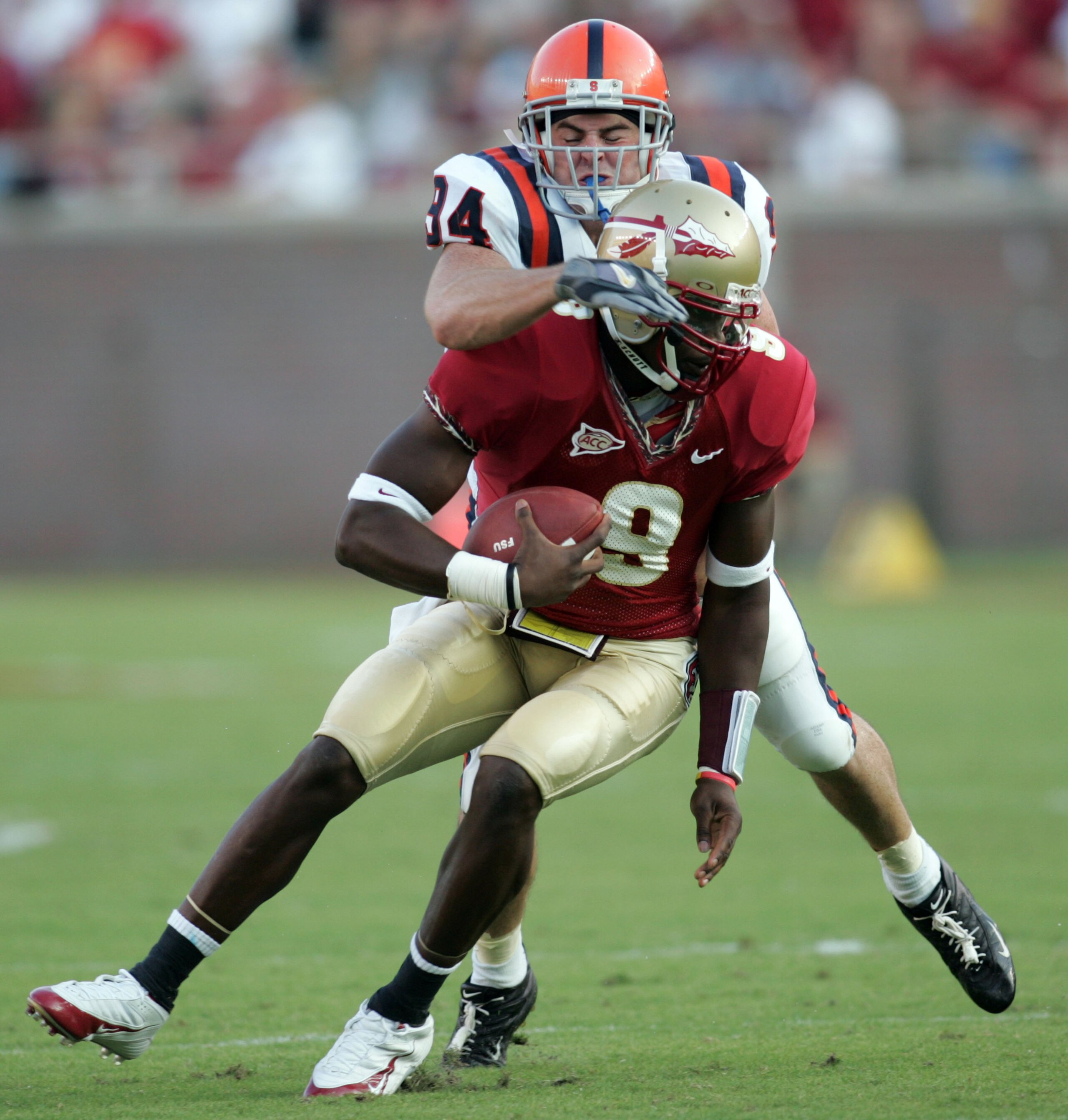 TALLAHASSEE, FL - OCTOBER 1:  Quarterback Xavier Lee #9 of Florida State is tackled by Ryan LaCasse #94 of Syracuse at Doak Campbell Stadium October 1, 2005 in Tallahassee, Florida. Florida State defeated Syracuse 38-14.  (Photo by Chris Graythen/Getty Im