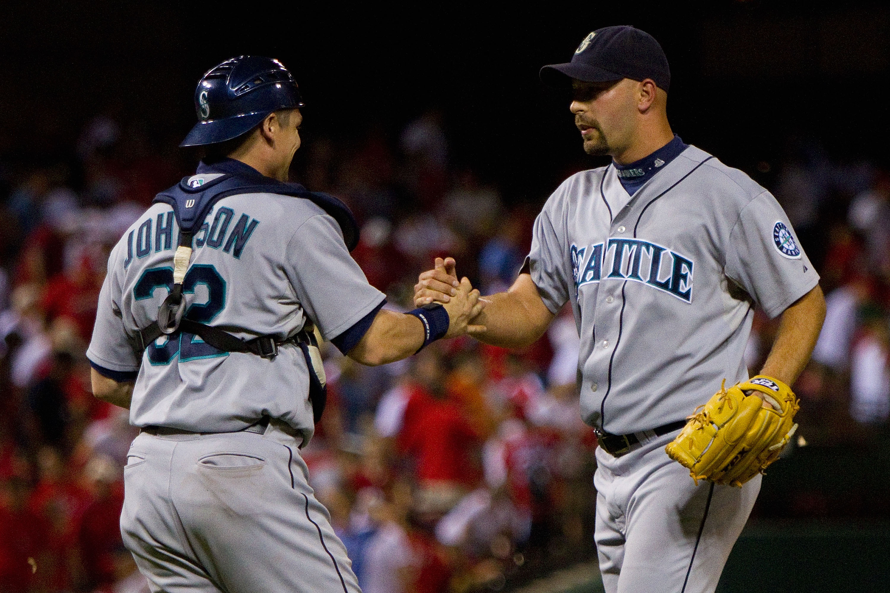 ST. LOUIS - JUNE 16: Rob Johnson #32 and David Aardsma #53 both of the Seattle Mariners celebrate beating the St. Louis Cardinals at Busch Stadium on June 16, 2010 in St. Louis, Missouri.  The Mariners beat the Cardinals 2-1.  (Photo by Dilip Vishwanat/Ge
